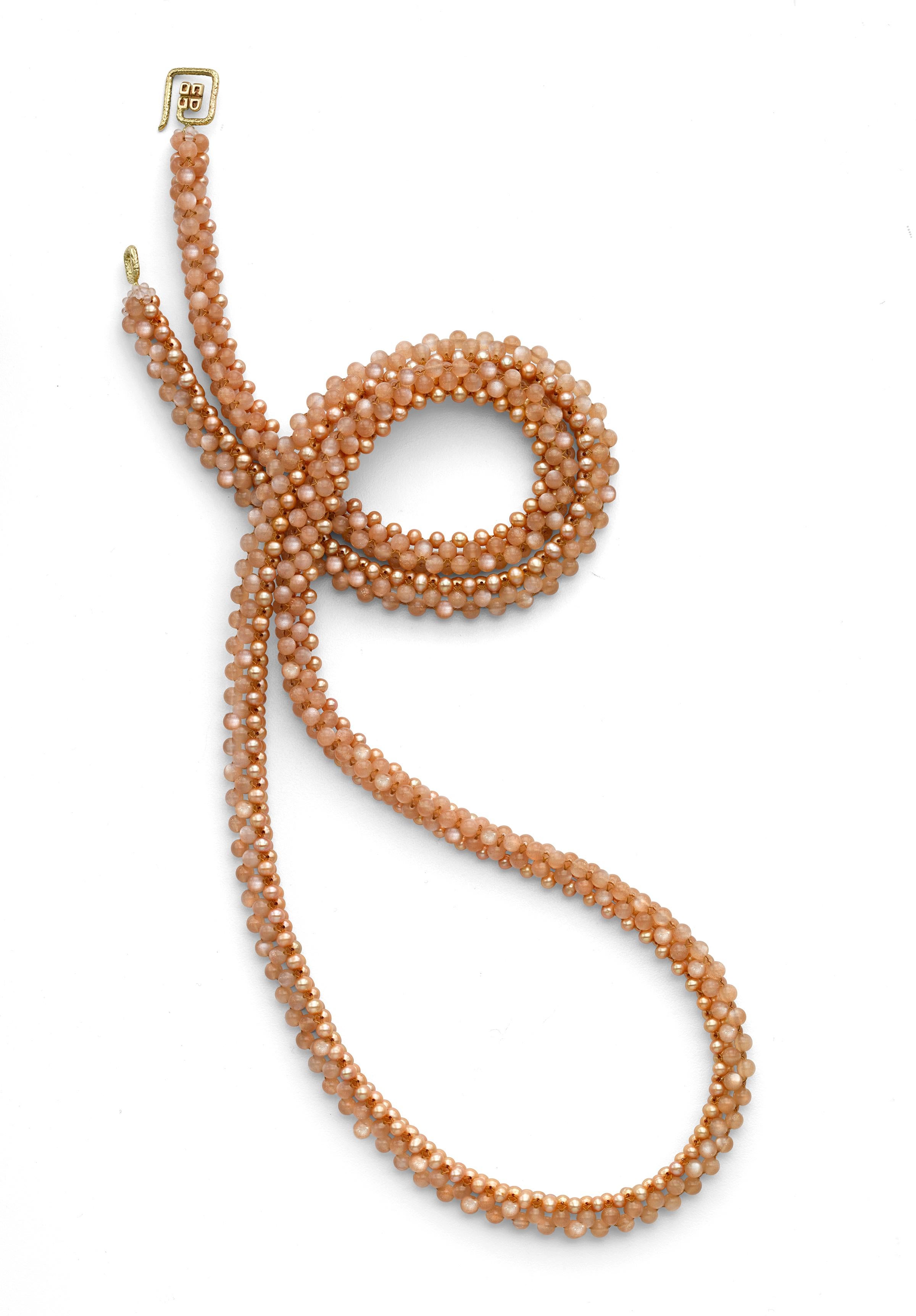 Long Beaded Rope Tassel Necklace woven of pink pearls and peach moonstone with 18K white gold clasp. Adjustable to be worn doubled up or long both with and without the tassel for a total of 4 distinct looks.  Easily transitioning from day to night,