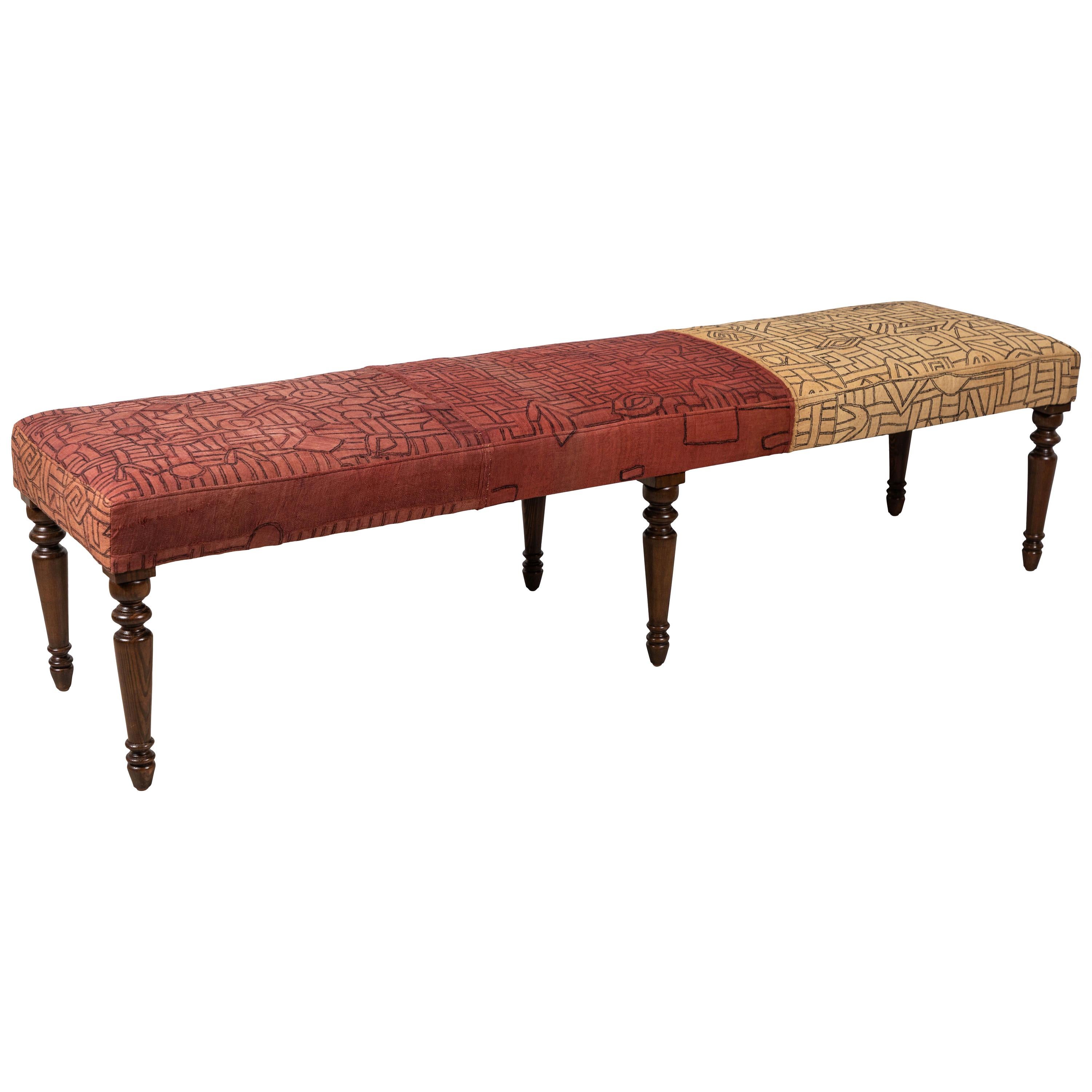 Long Bench with Stained Turned Legs Upholstered in Vintage African Kuba Cloth