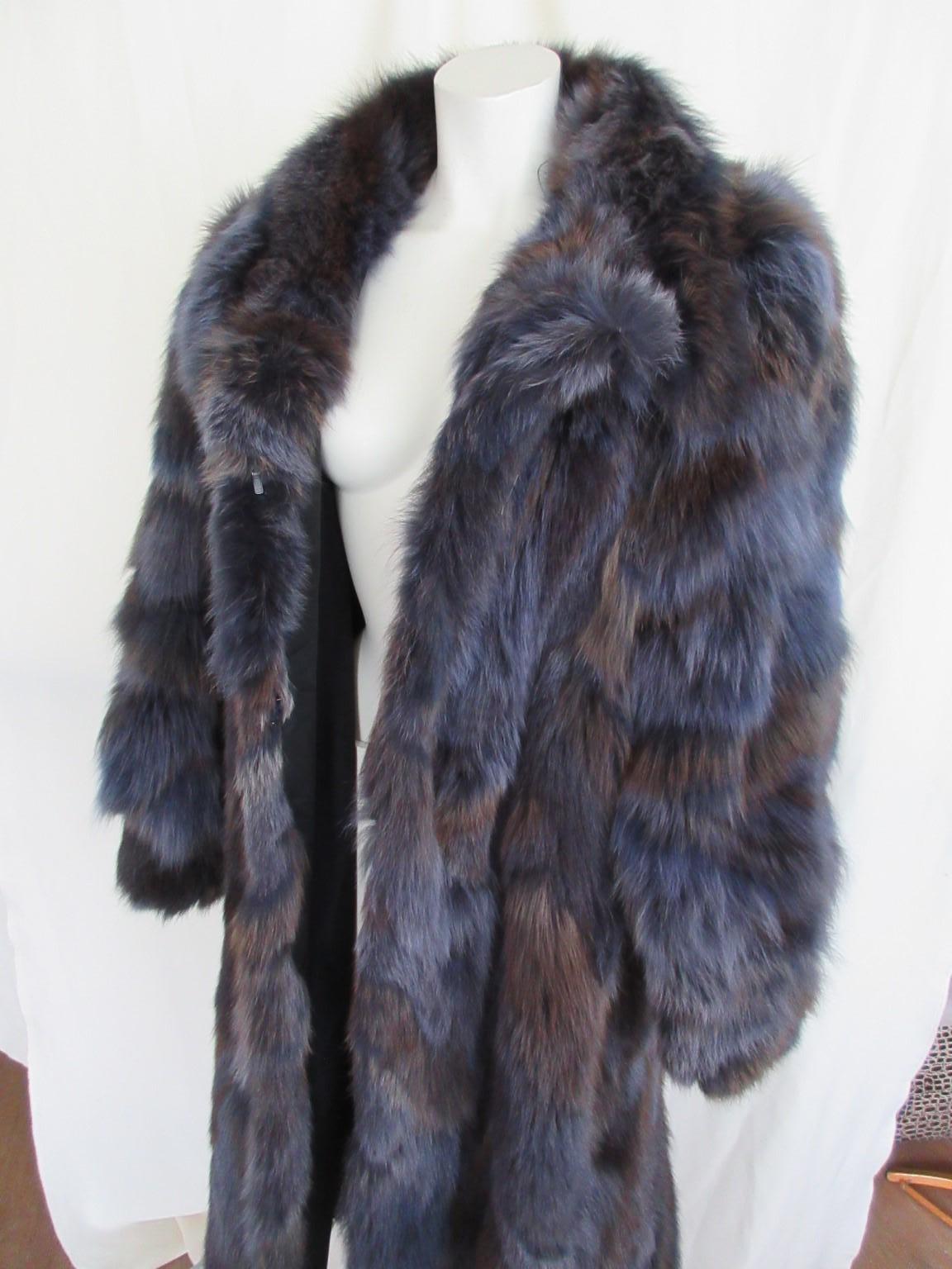 We offer more exclusive vintage fur items, view our frontstore

Details:
This vintage coat is dyed in a special blue/grey/brown color fox fur
with 2 pockets , 1 collar button and 3 closing hooks.
The quality of the fox fur is very soft and light to