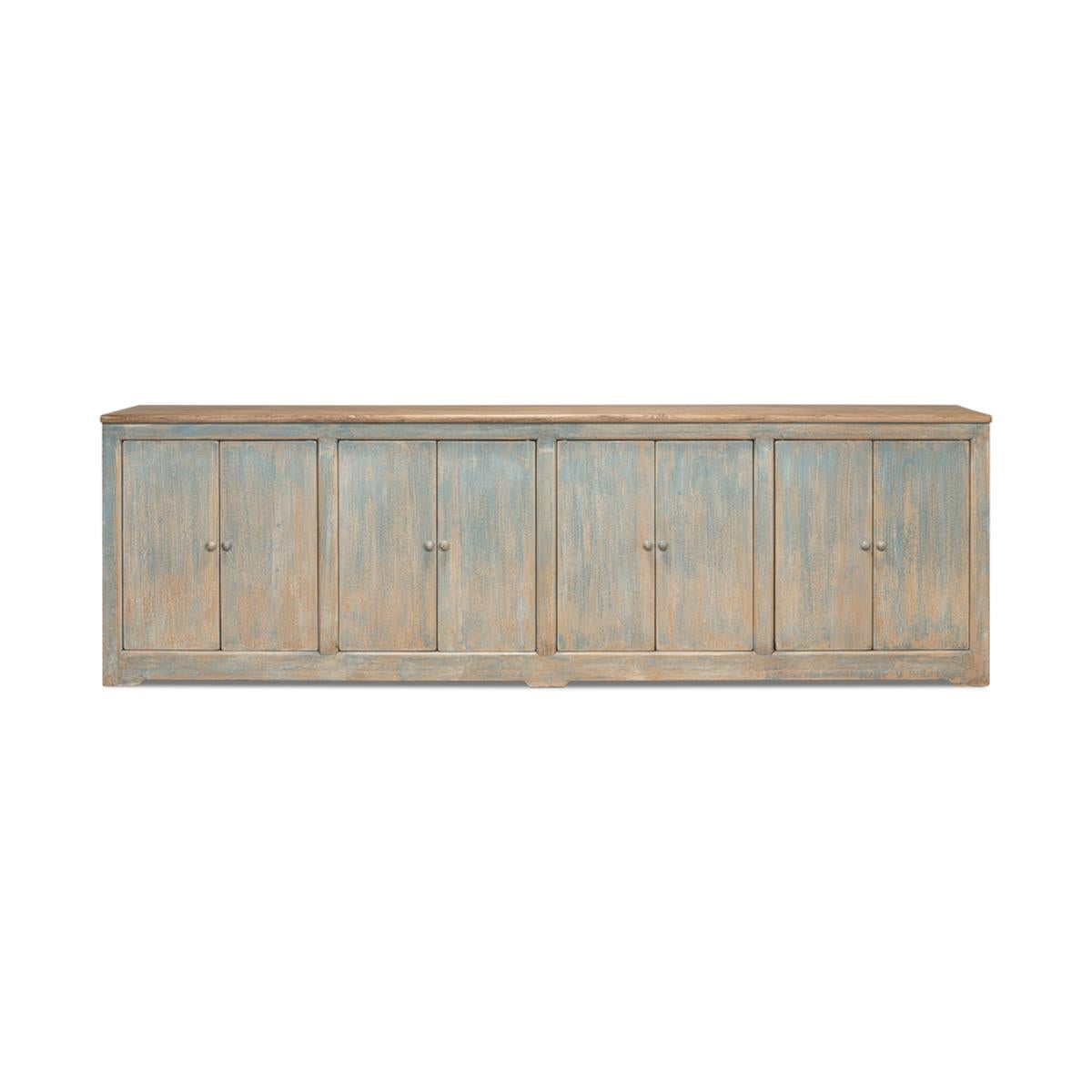 An eight door pine sideboard cabinet with a soft painted rub through antiqued bluewash finish with a natural finish top. Doors open to reveal a painted interior with removable shelves.

Dimensions: 122