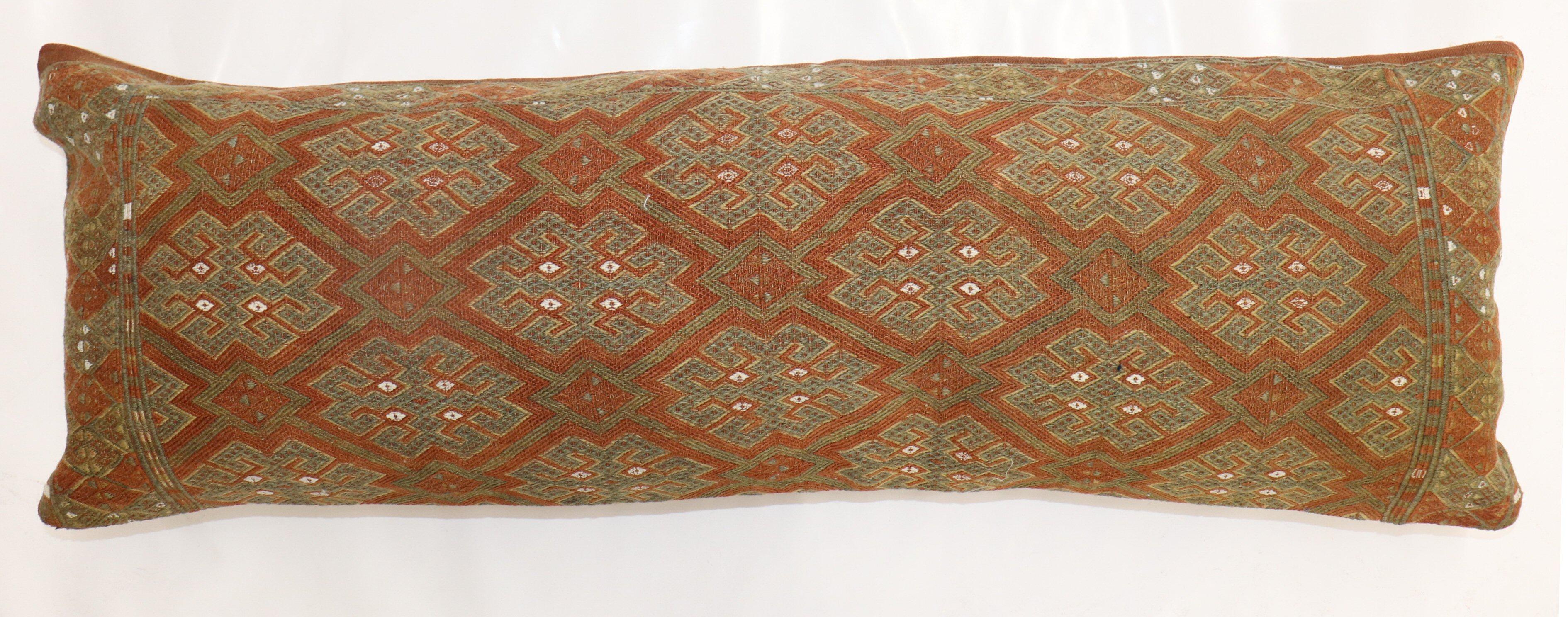 Pillow made from a Turkish flat-weave jajim . 

Measures: 13'' x 38''.
