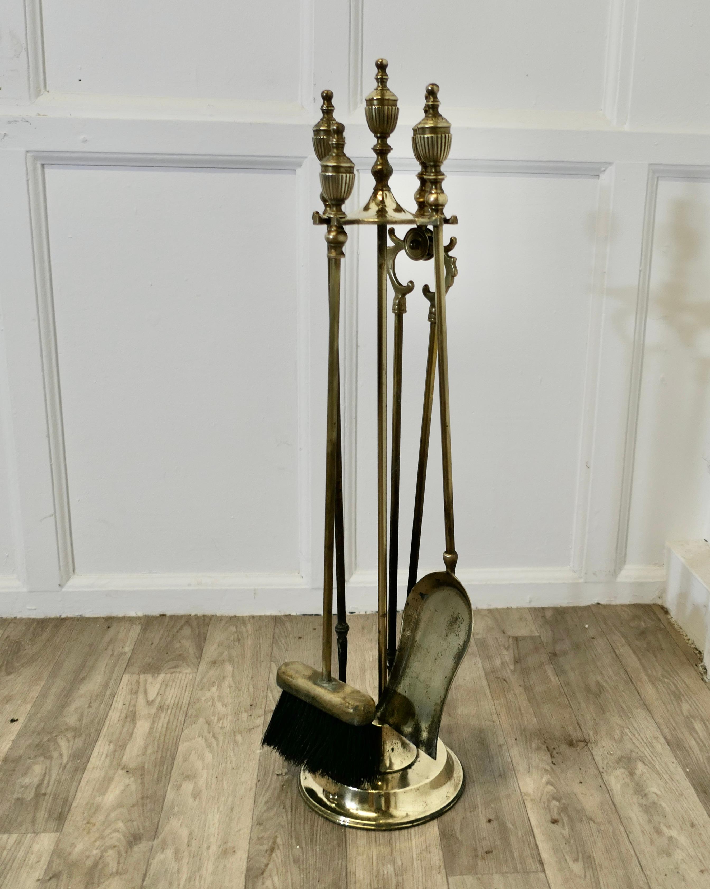 Long Brass Fireside Companion Set, Fireside Tools on Stand

This is a long handled set on its own stand, shovel, tongs, brush and poker  
The stand 32” tall and 8” in diameter
TNG223