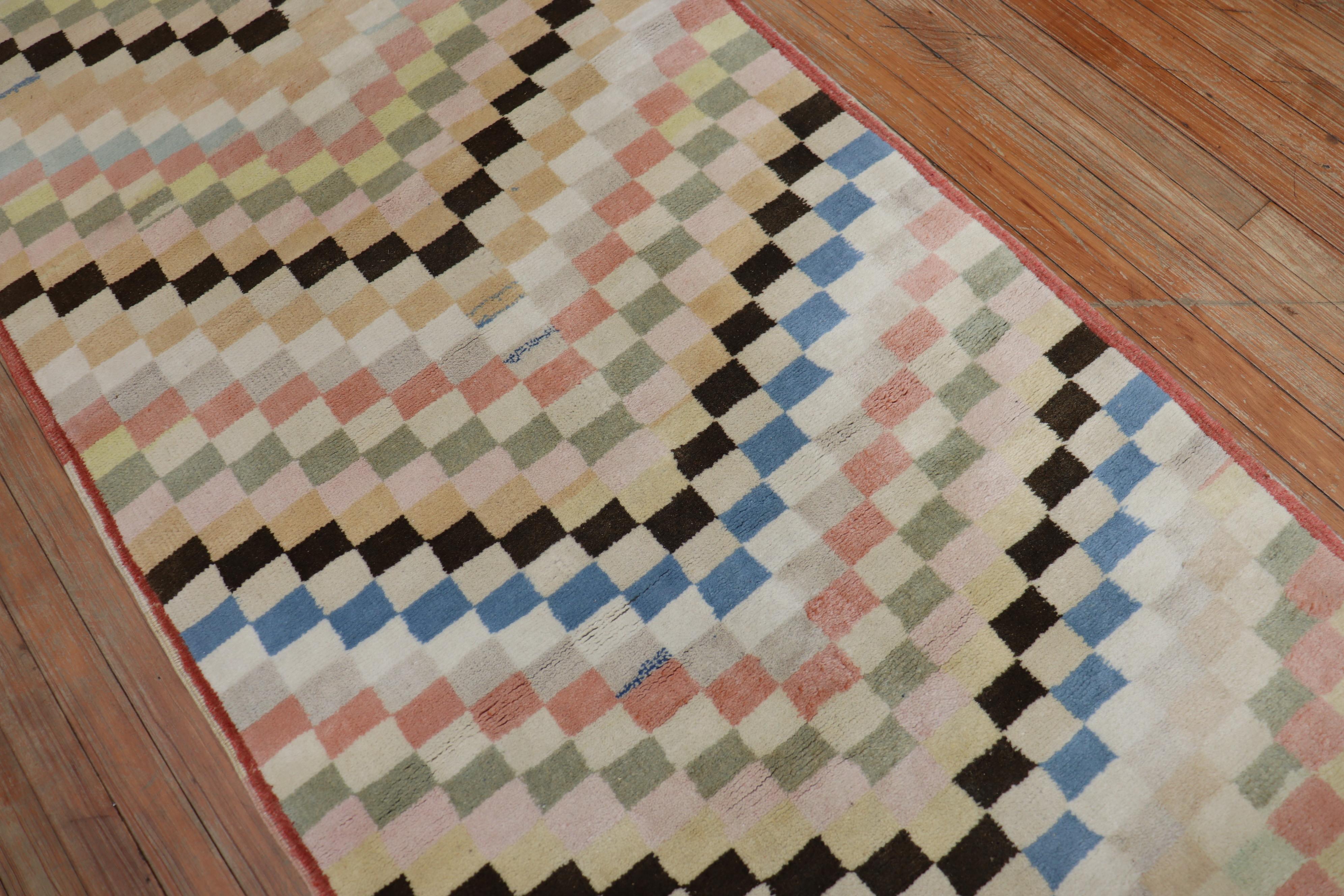 Rare long runner size 3rd quarter of the 20th century Turkish deco rug with a repetitive all-over checkerboard design in an assortment of different colors. Originally custom made for a hallway in a private estate in ankara turkey

Measures: 3' x