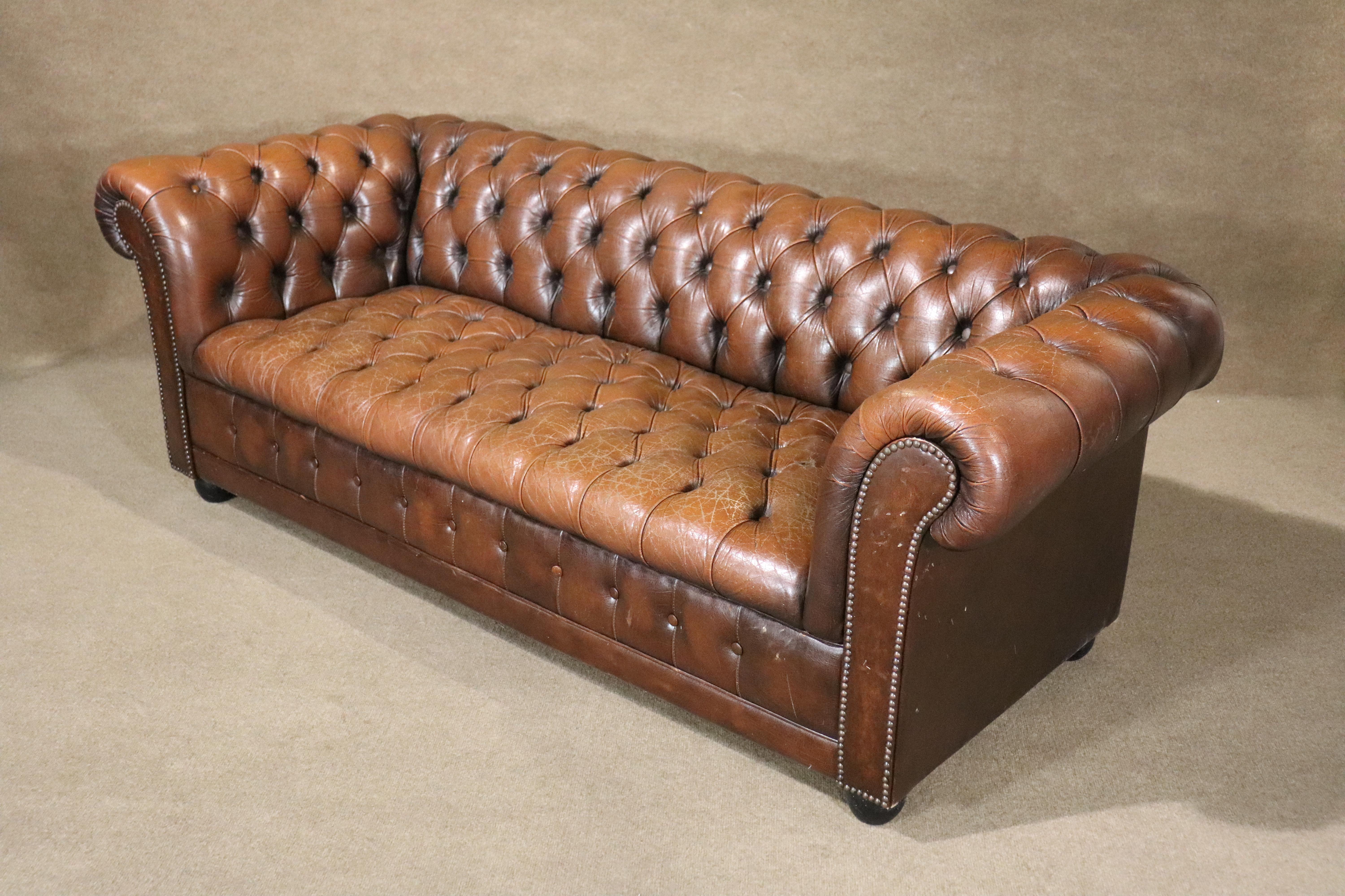 Six foot long tufted chesterfield sofa. Great age and wear to the leather.
Please confirm location NY or NJ