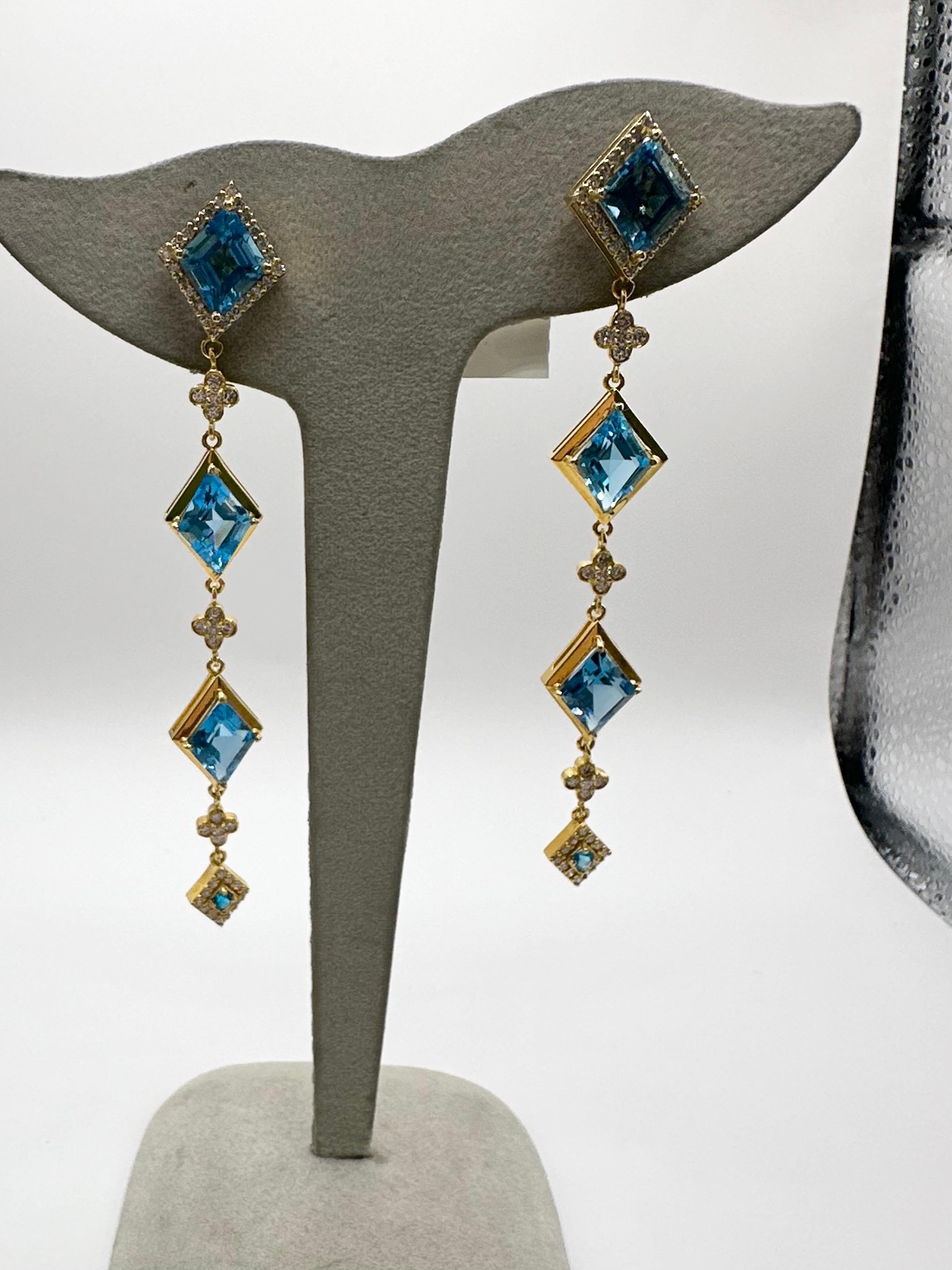 Stunning Topaz earrings in 18KT solid gold! One of a kind custom cut topaz in long dangling syle! So perfect with jeans or a dress! 1 carat of fine quality diamonds VS clarity and F-G color and fine quality topaz weighing more than 13