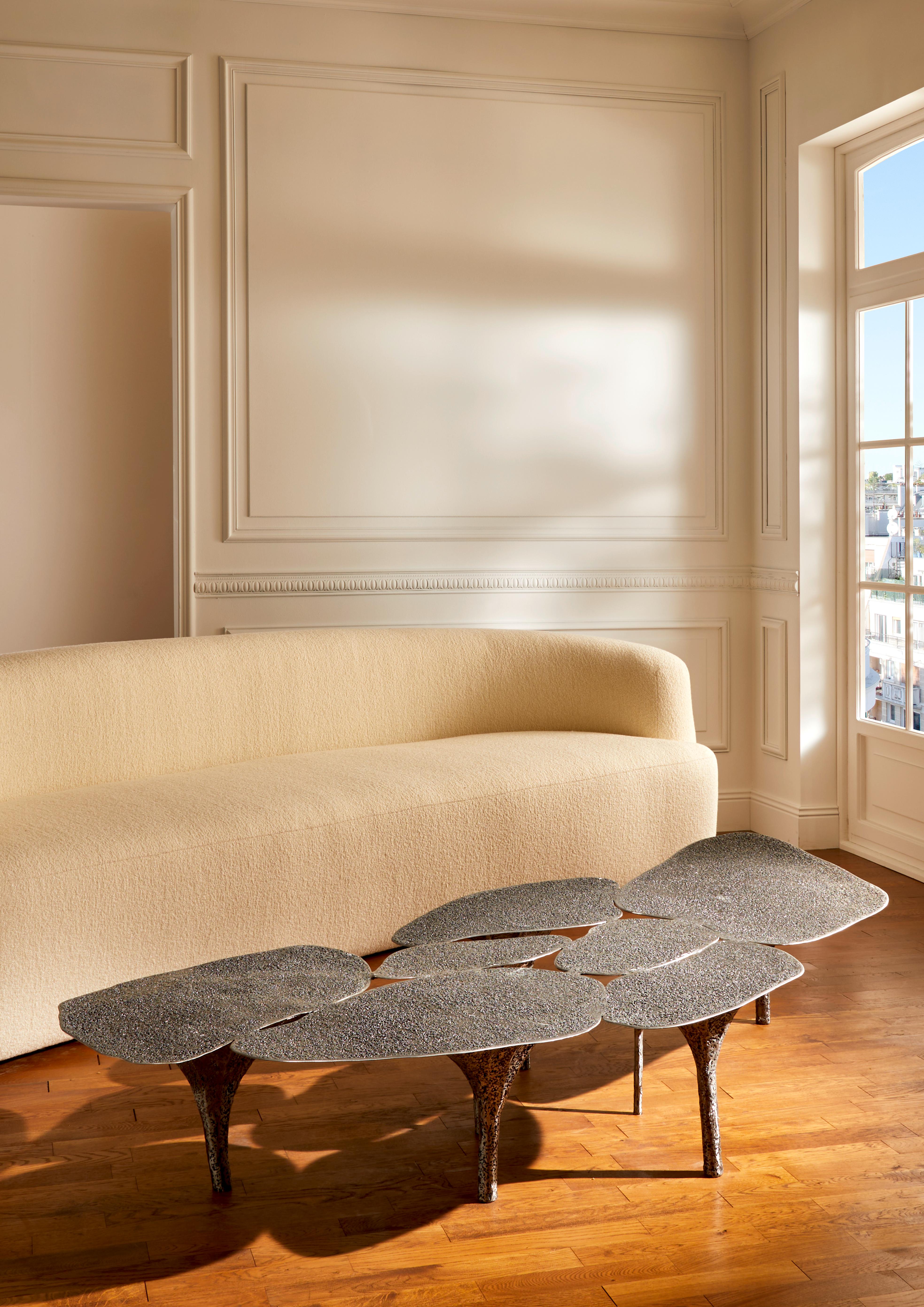 Coffee table in textured and patinated steel.
Signed piece by the artist K. Chanel.
France, 2025.