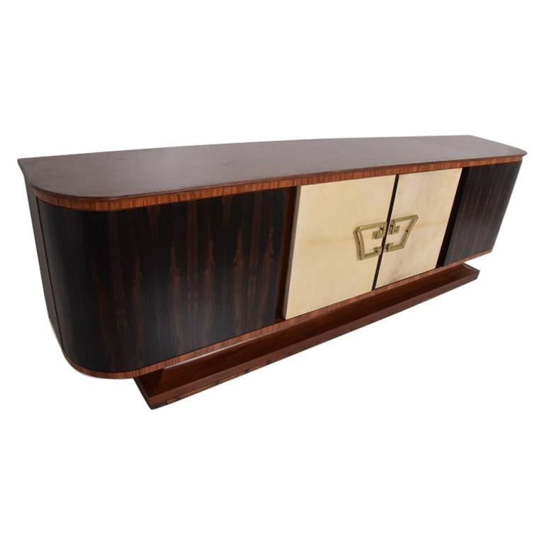 Mexican Modern Regency curved credenza designed in exotic wood 
Goat skin ziricote rosewood and mahogany.
Center doors are covered in goatskin leather. Solid brass pull handles.
Custom-made in Mexico City circa 1950s attribution Roberto & Mito