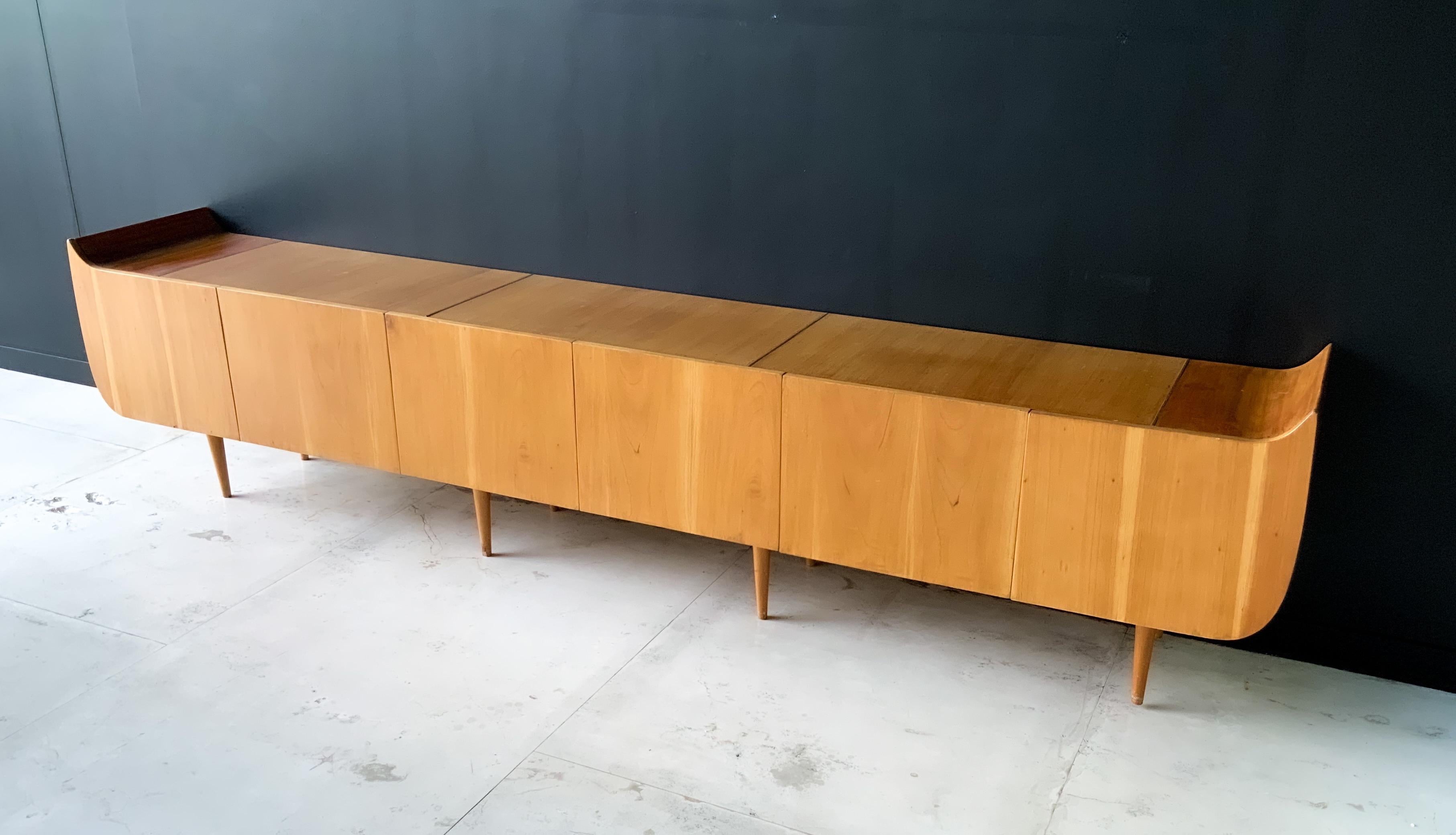 Beautiful credenza made in walnut and mahogany with brass details.