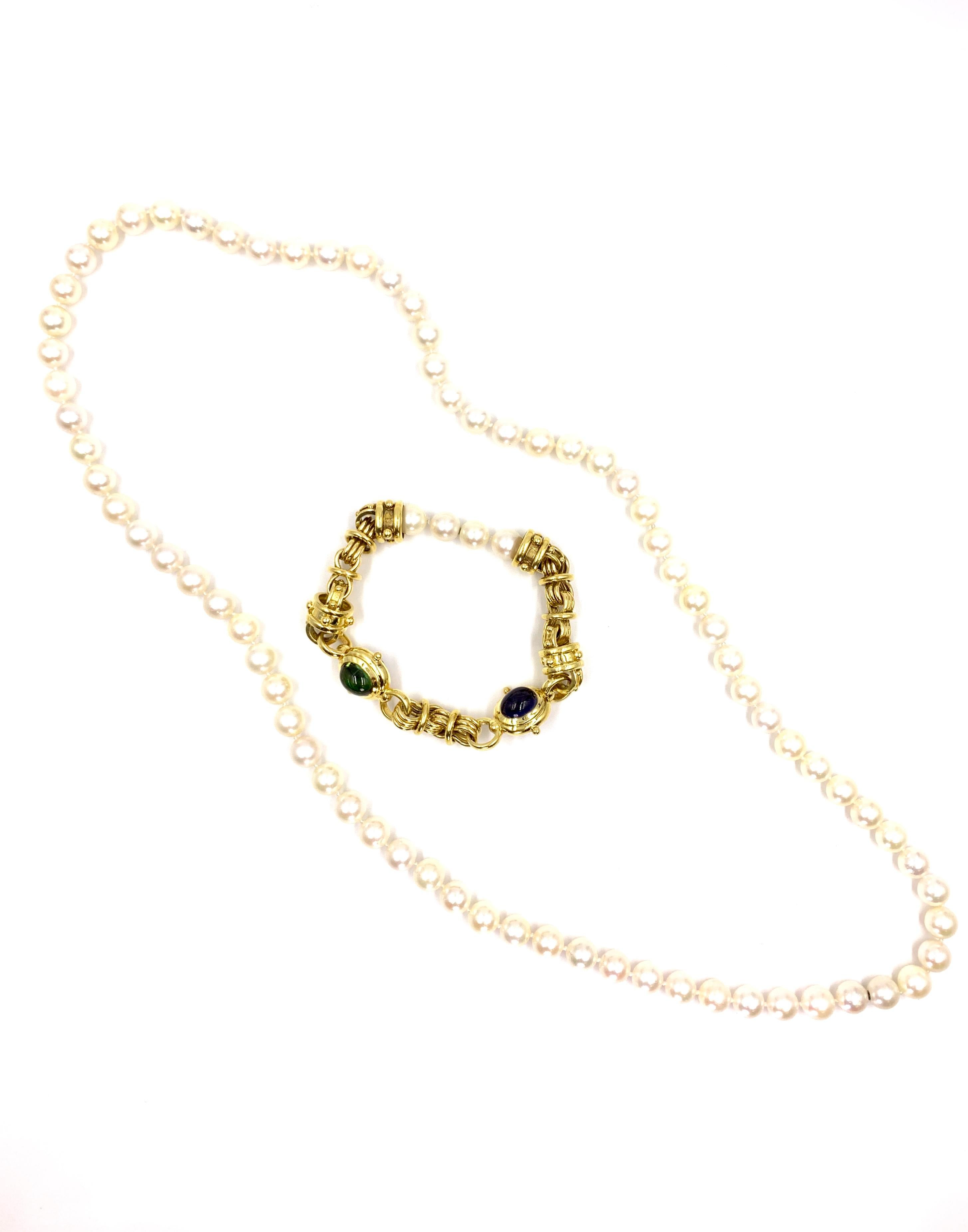 A beautiful and versatile piece with several wearable options. This long cultured pearl necklace can be worn with the 18 karat gemstone linked bracelet attached or separately using 