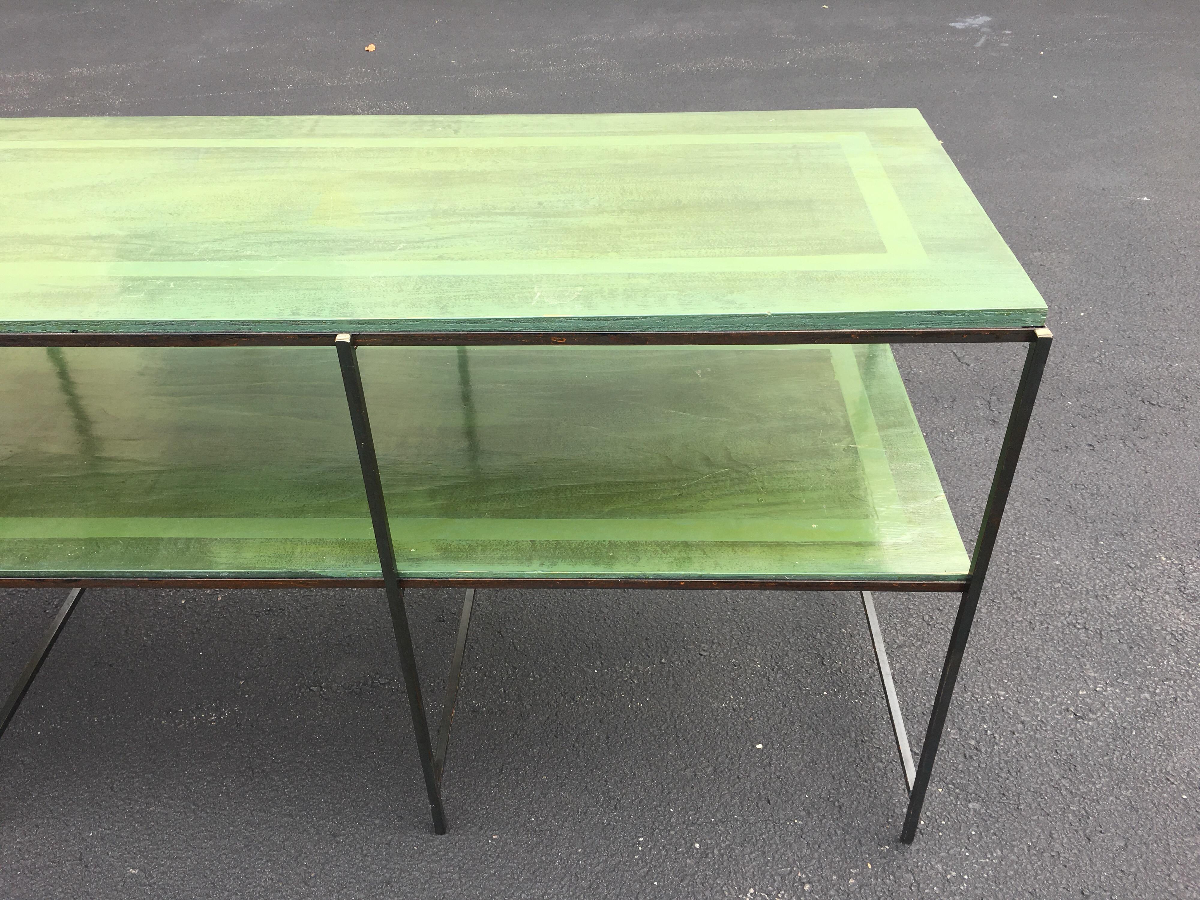 This simple Classic iron tiered table has a great look. It was custom-made with a brushed custom green finish and an inset border stripe. A very sharp high gloss finish.