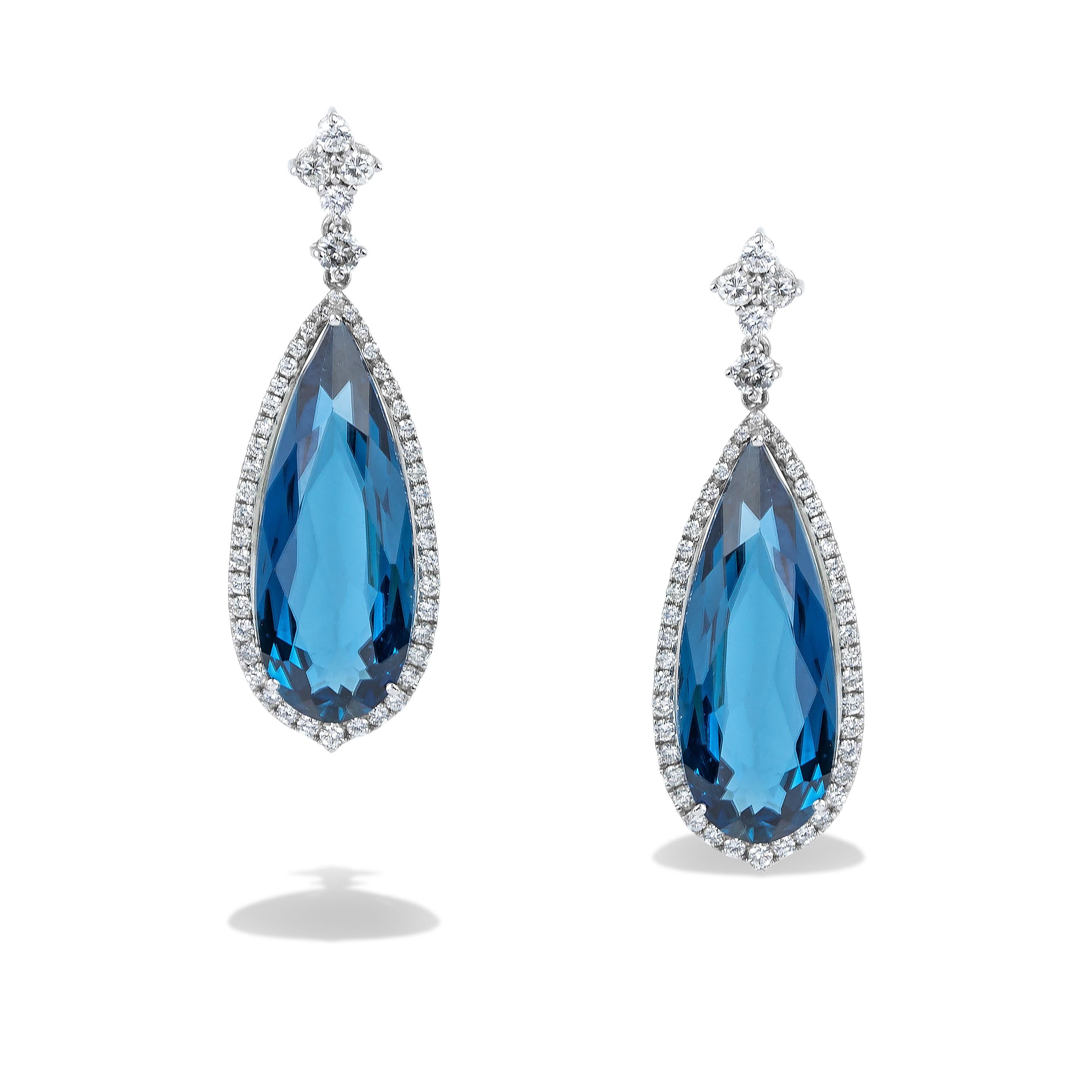 Modern Long Dangle Earrings Pear shape with London Blue Topaz and Diamonds in 18kt Gold For Sale