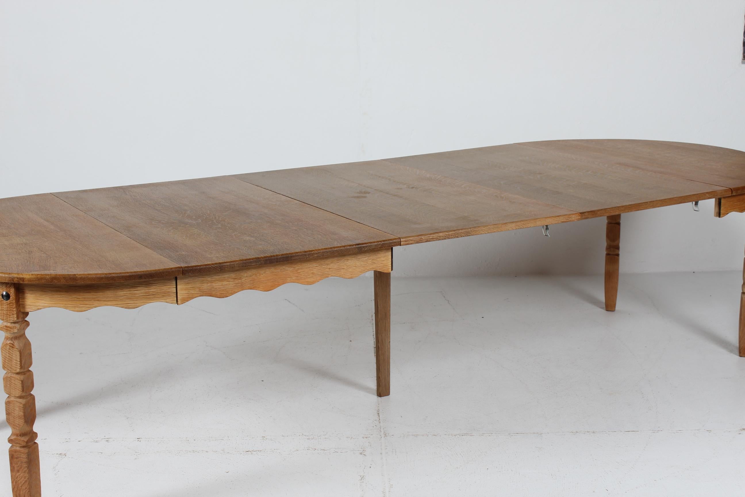 Long Danish 3 Leaves Extendable Dining Table of oak by Henning Kjærnulf 1970s 5