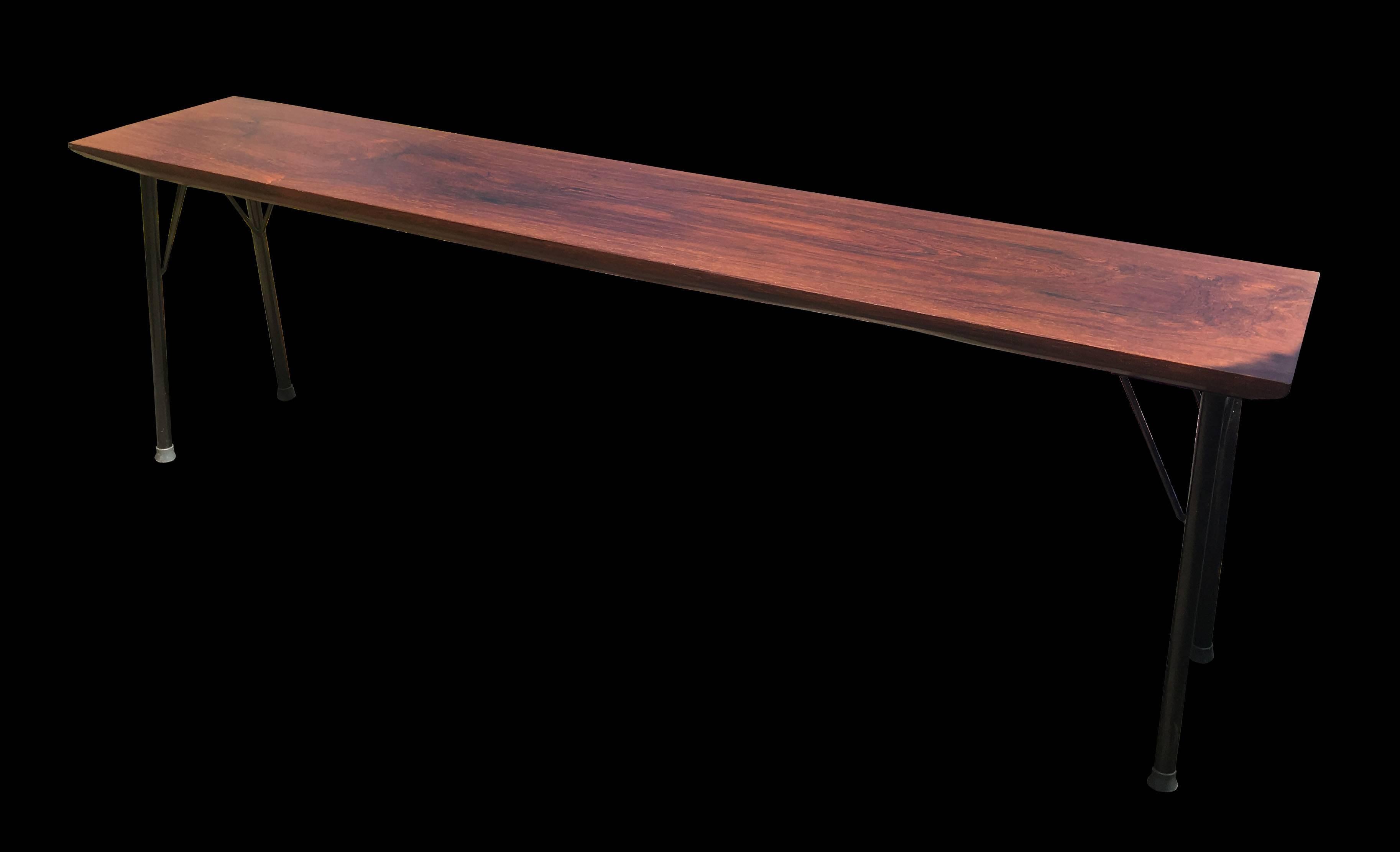 This is a very unusual piece, probably unique, the top is solid rosewood and it is supported by black steel legs.