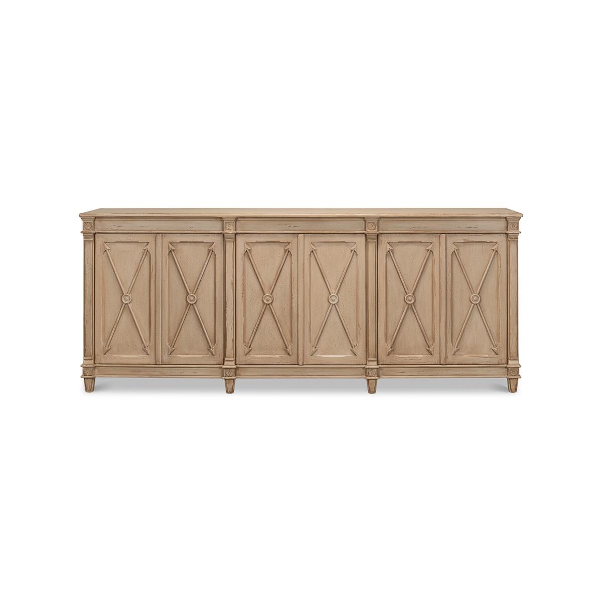 Antiqued Buffet with a hand rubbed and distressed dark beige finish to the six-door cabinet, each with a cross arrow design. This piece is crafted in pine and has an antiqued rustic finish. The painted interior is fitted with removable