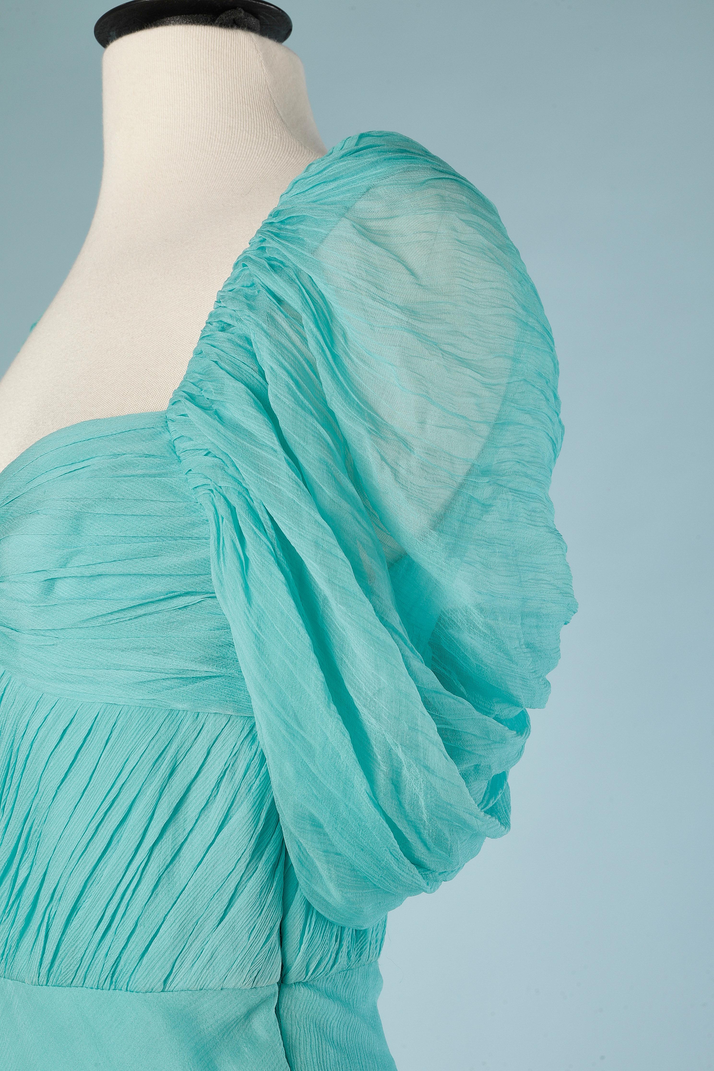 Long asymmetrical drape evening dress in turquoise silk chiffon. Boned. Biais. 
SIZE S
