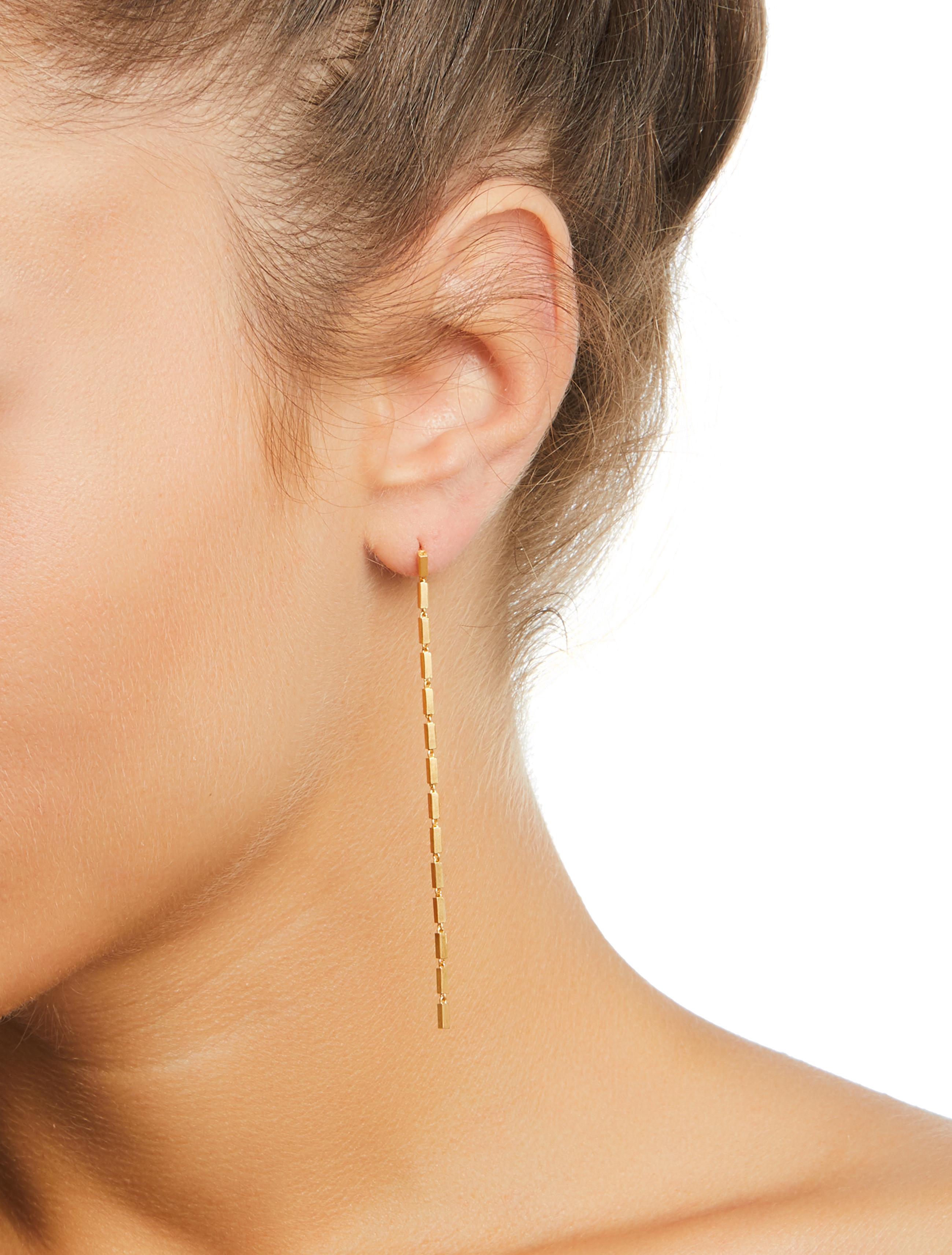 Disco Single Long

18 karat gold plated sterling silver chain earrings that consists of rectangular motifs linked to each other. These earrings are very lightweight and can be worn in all occasions. All of our earrings have 10 K posts to avoid