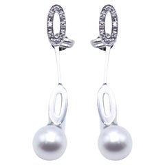 Long earrings in white gold and pearls