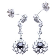Long earrings with diamonds.