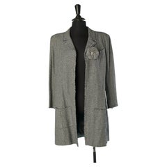 Long edge to edge jacket with chevron pattern and fabric Camelia CHANEL
