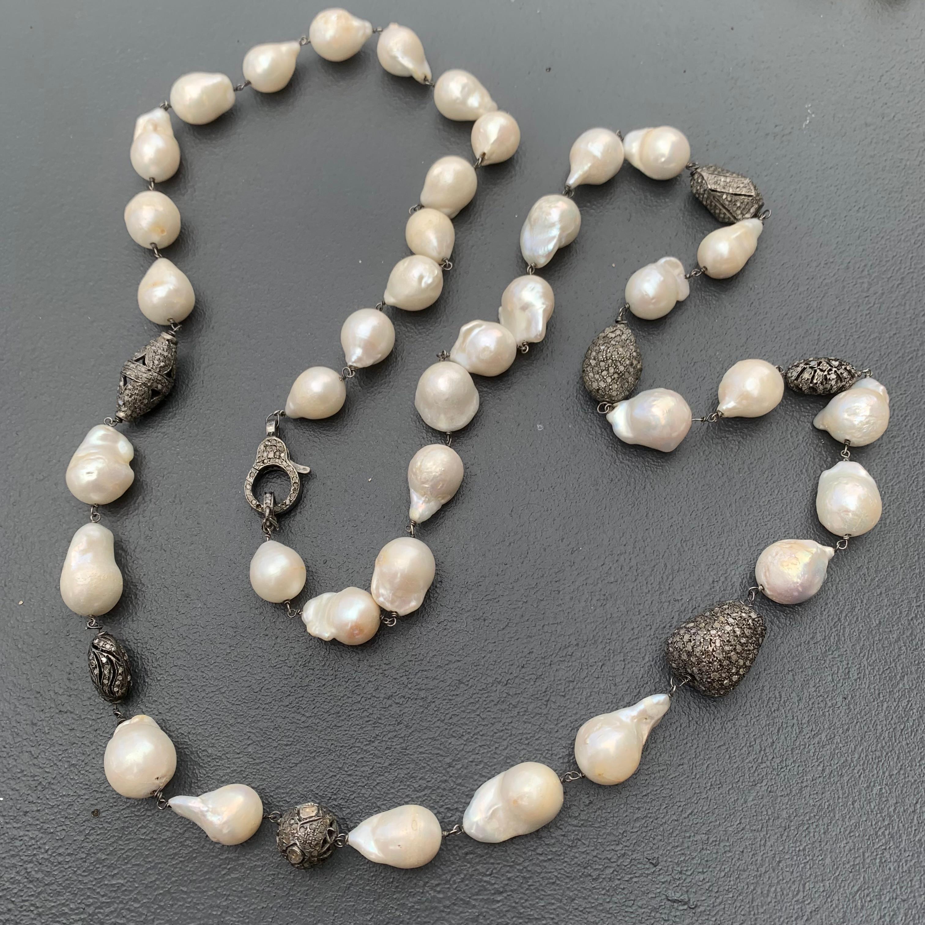 Long Very well made Estate large Baroque Pearls with Silver Pave Diamond Bead necklace . Lobster clasp also has pave diamonds set in silver .  Contemporary with twist to a timeless strand of classic pearls necklace . 
 All beads are hand wired .