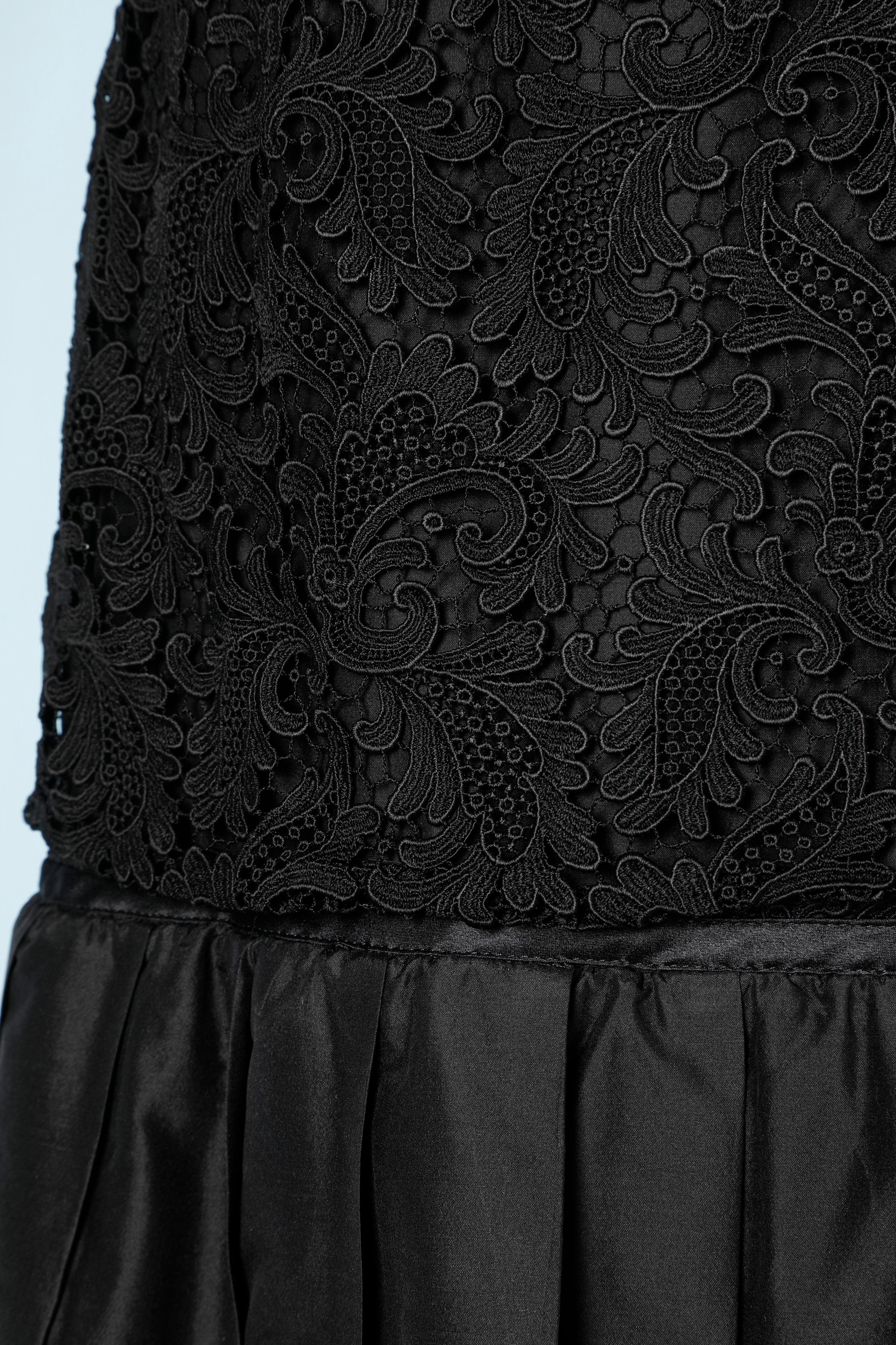 Long evening skirt in black lace and pleated taffetas.
Size M