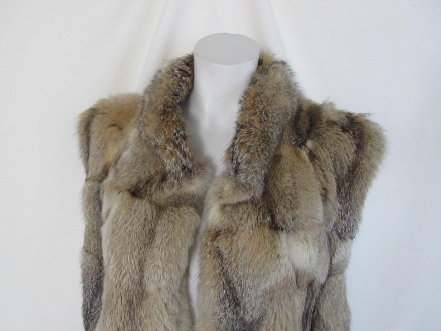 This vintage fur vest is made of soft quality fox fur.

We offer more luxury fur items, view our frontstore

Details:
Sleeveless, no pockets / buttons
This vest can be worn by male or female.
Can be worn on leather jacket or sweater or inside a