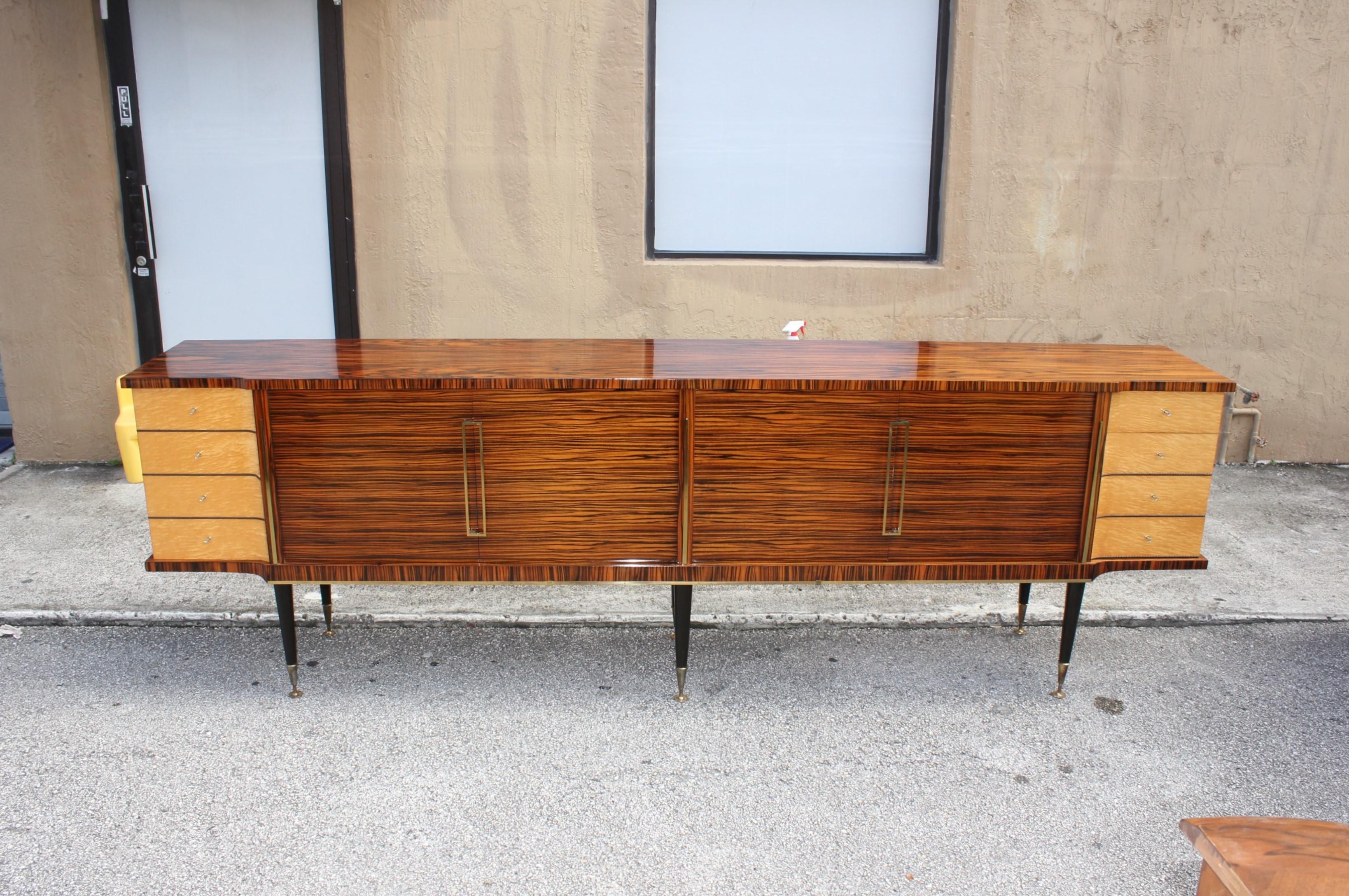 Long French Art Deco exotic Macassar ebony with burl wood sideboard or buffet, circa 1940s. With four drawers burl wood, and the bar door section are in burl wood, two shelves adjustable, and you can remove the shelves if you need more space, six