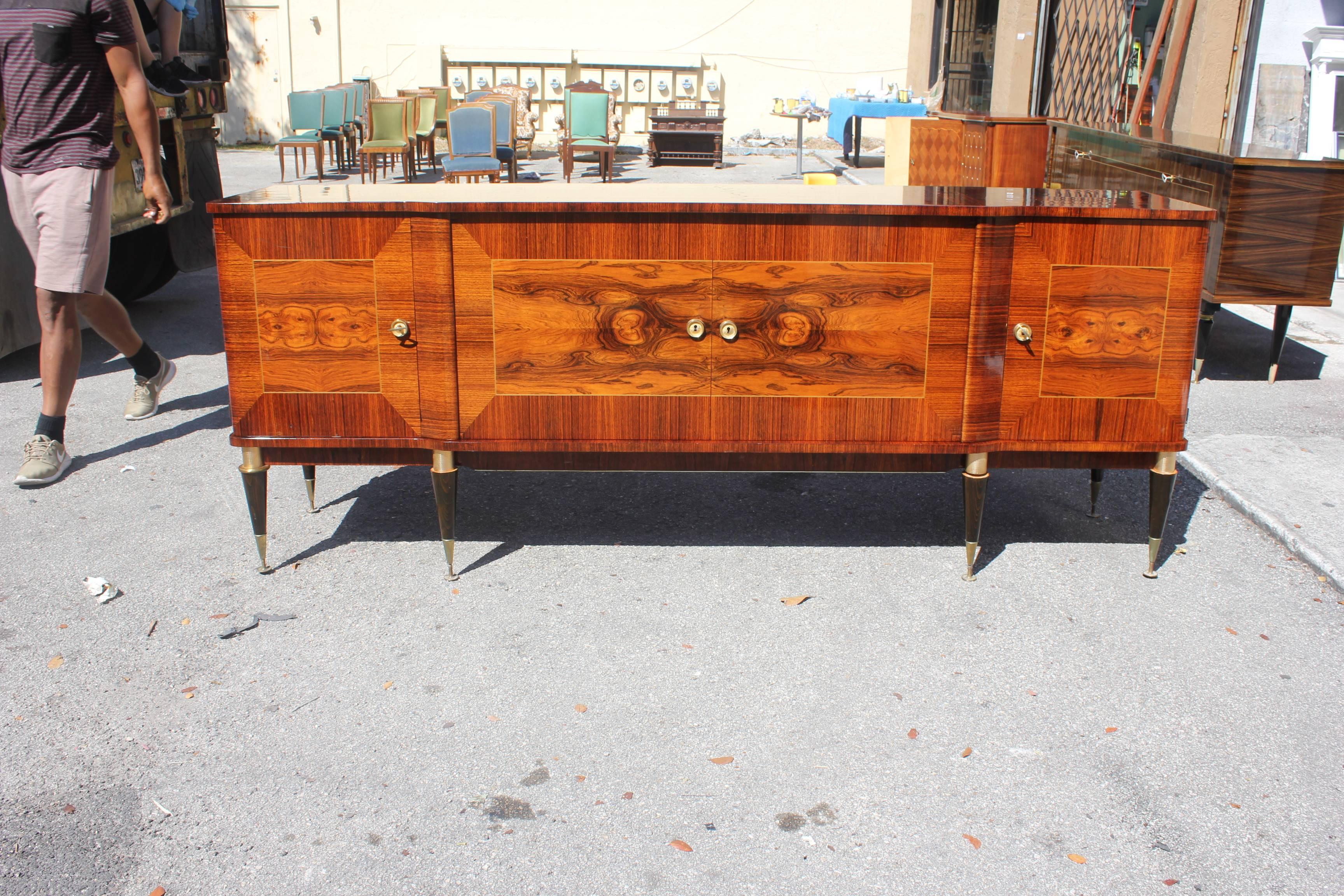 Description long French art deco exotic Macassar ebony sideboard or buffet with two centre drawers inside and we have all shelves, beautiful bronze hardware detail, circa 1940. Please note these buffets can be taken apart to accommodate elevator