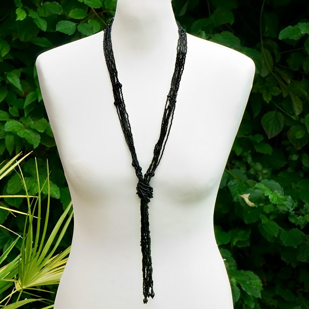Wonderful long ornate french jet beads flapper necklace with a tassel. The necklace tassel knot can be undone, and the length adjusted to suit. Measuring approximately necklace length 73.5 cm / 29 inches, and the tassel and knot is length 20 cm  /