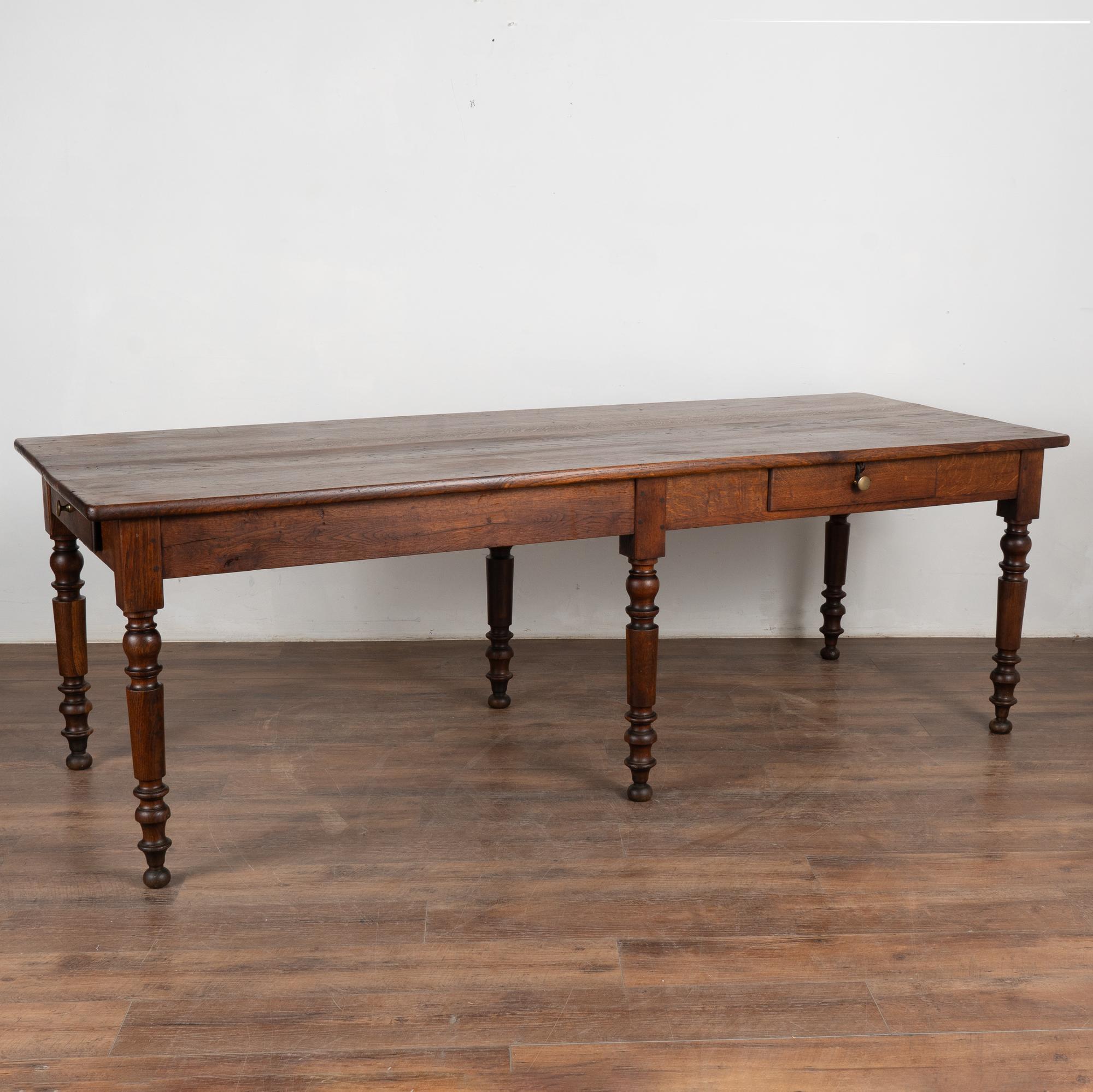 It is the stunning wood and deep aged patina that draws one to this 7.5' long oak console table from France.
The generations of use are revealed in every old knot, nick, crack, scratch and stain, etc. all resulting in the incredible patina that