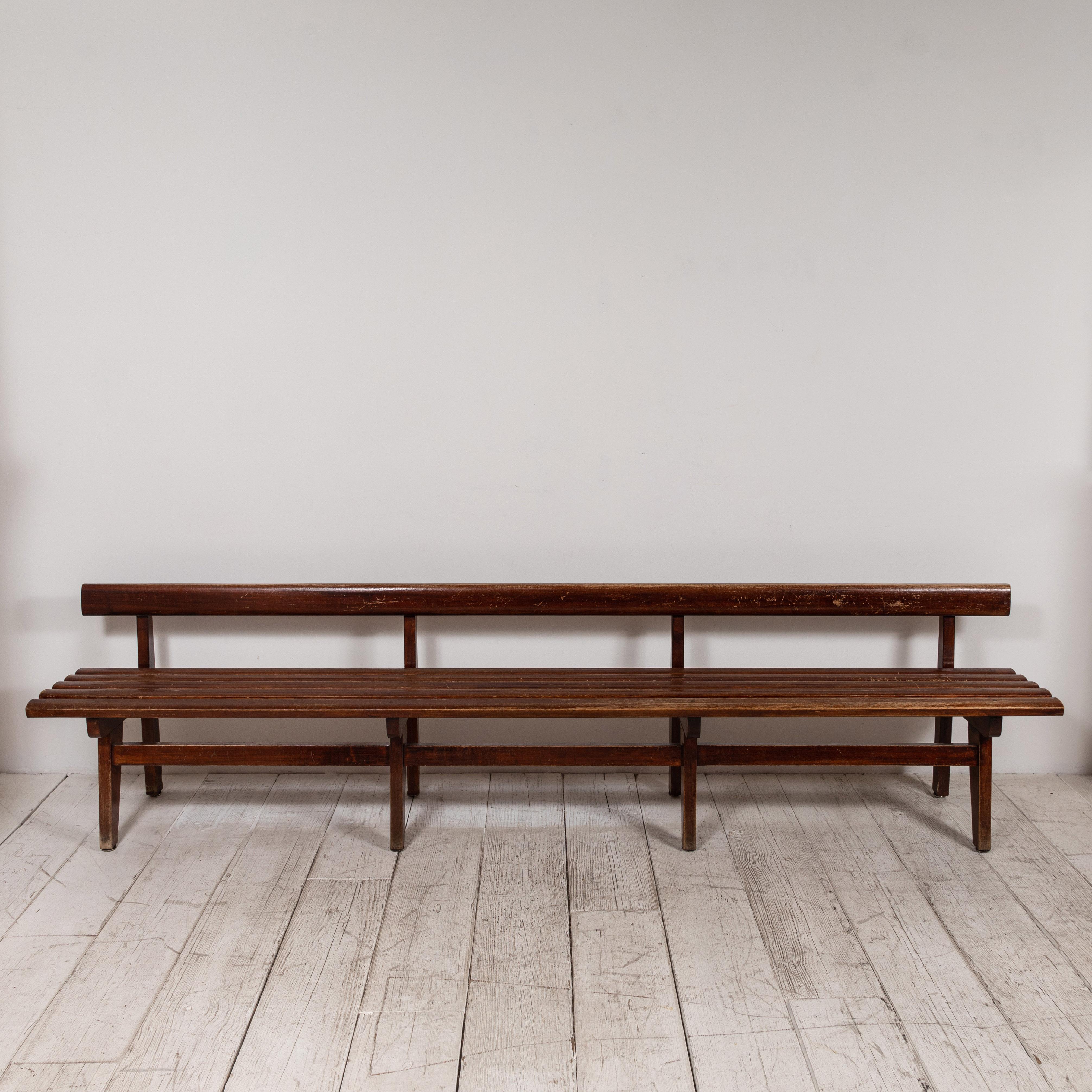 Long and low, this French slatted wooden bench is perfect for any hallway or room that has the space.