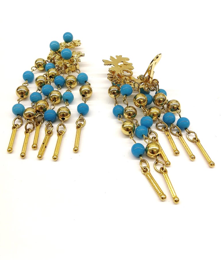 Long gilt metal and turquoise glass bead fringed earrings, Christian