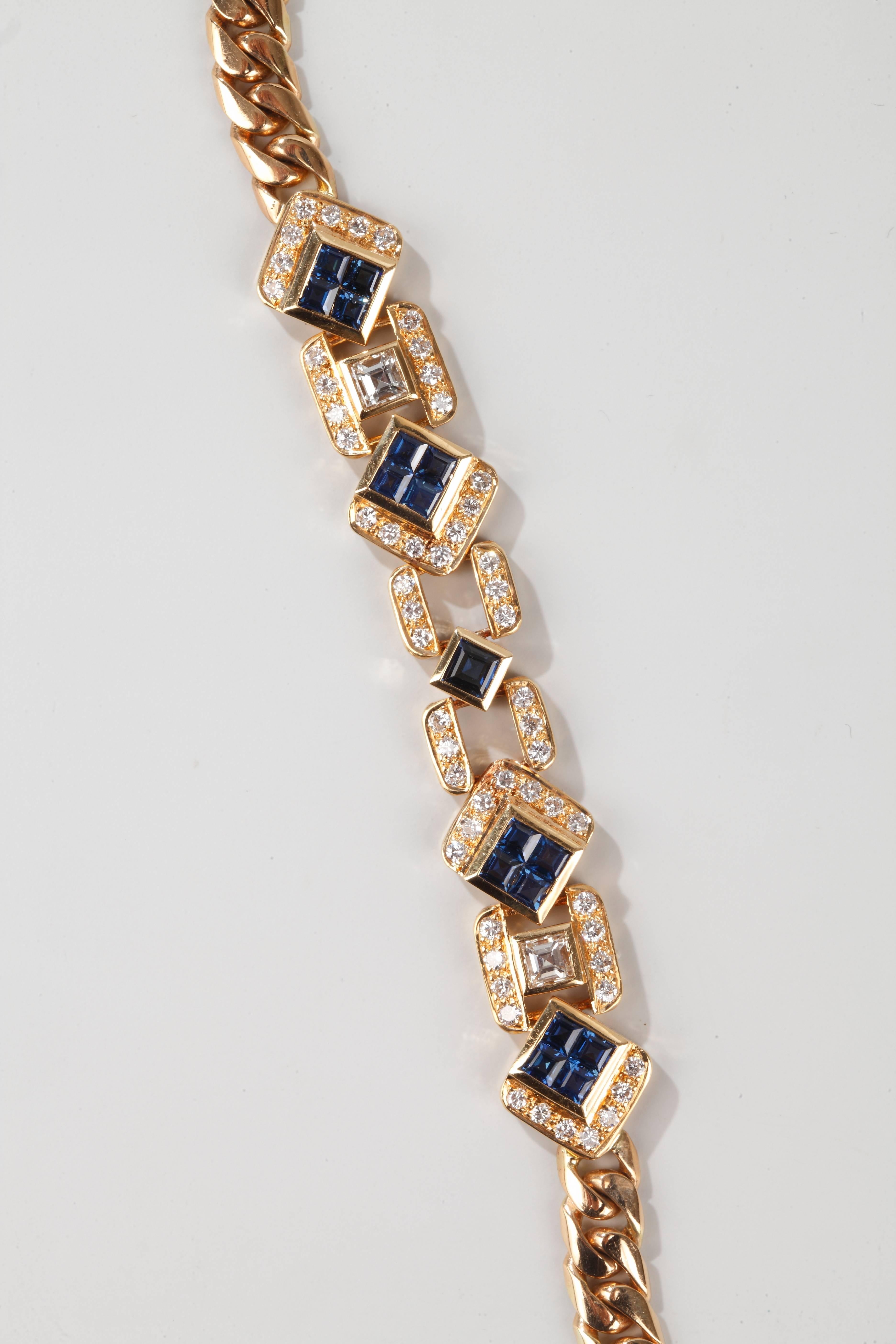 A long necklace formed of a mesh curb chain with four geometrical motives set with brillant and baguette cut diamonds and calibrated sapphires.
Signed ADLER.
