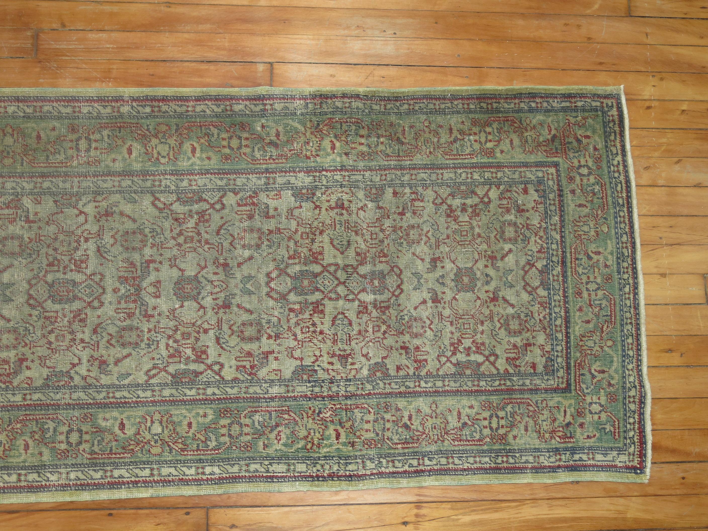 A Turkish runner from the early 20th century with a gray field, green border, accents in red

Measures: 2'6'' x 15'4''


Often finely woven, Sivas carpets tend to be made within a classically-derived Persian idiom of medallion and all-over