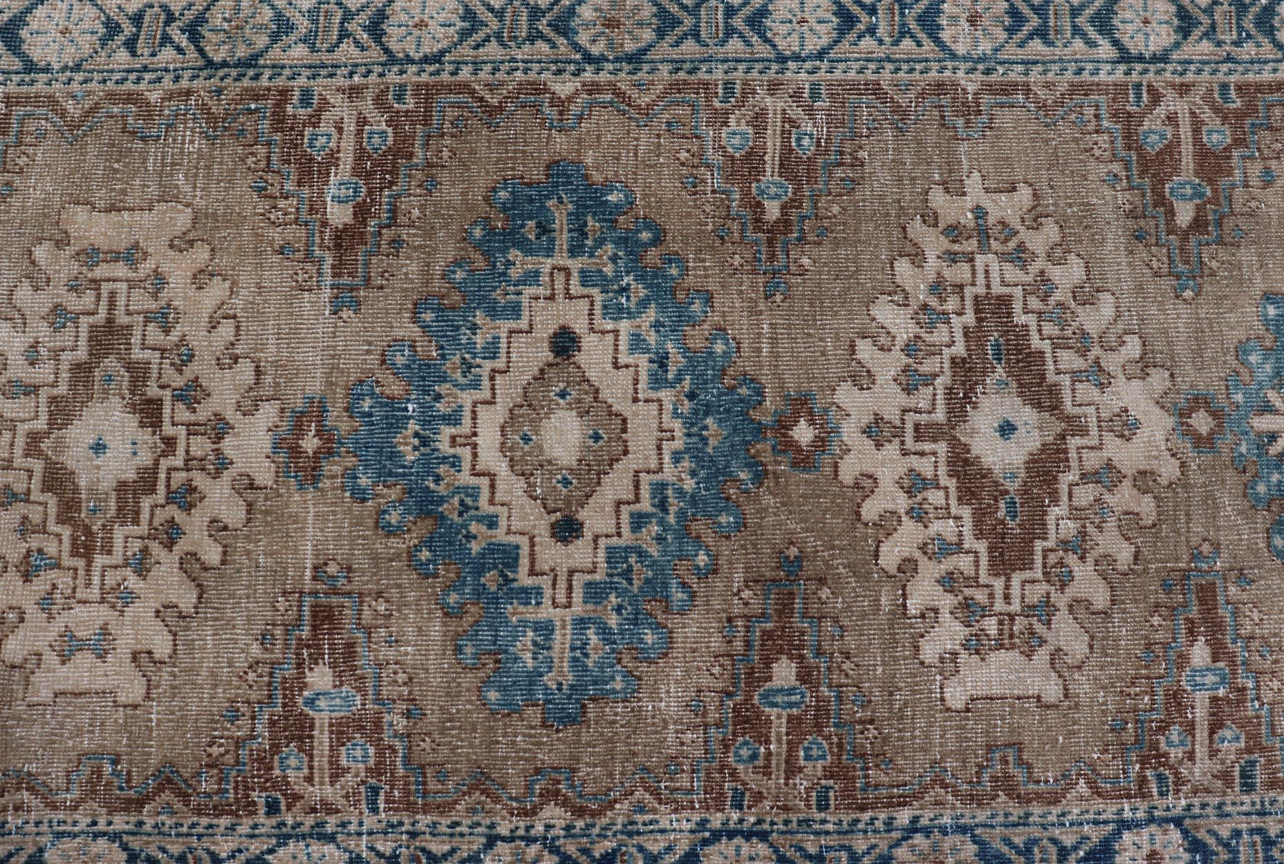 Persian Long Hand-Knotted Antique Heriz Runner in Wool with Sub-Geometric Medallions For Sale