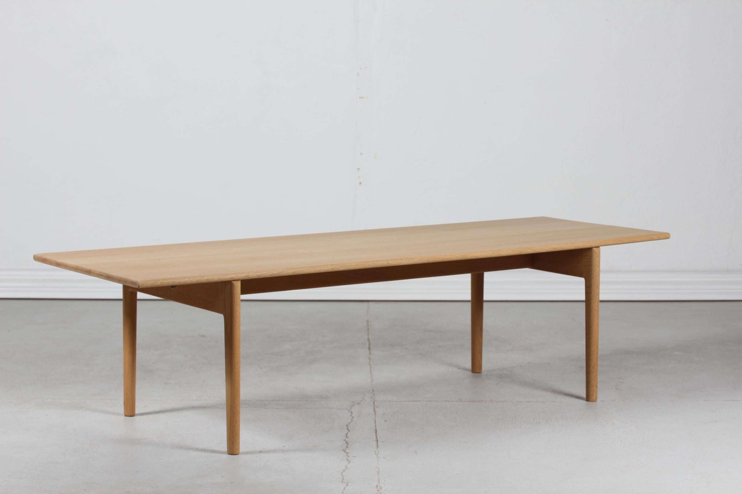 Very long coffee table by the Danish architect Hans J. Wegner (1914-2007) and manufactured by Andreas Tuck in the 1950s.

The coffee table is made of solid oak with soap treatment.

The table remains in very nice vintage condition ready for use.