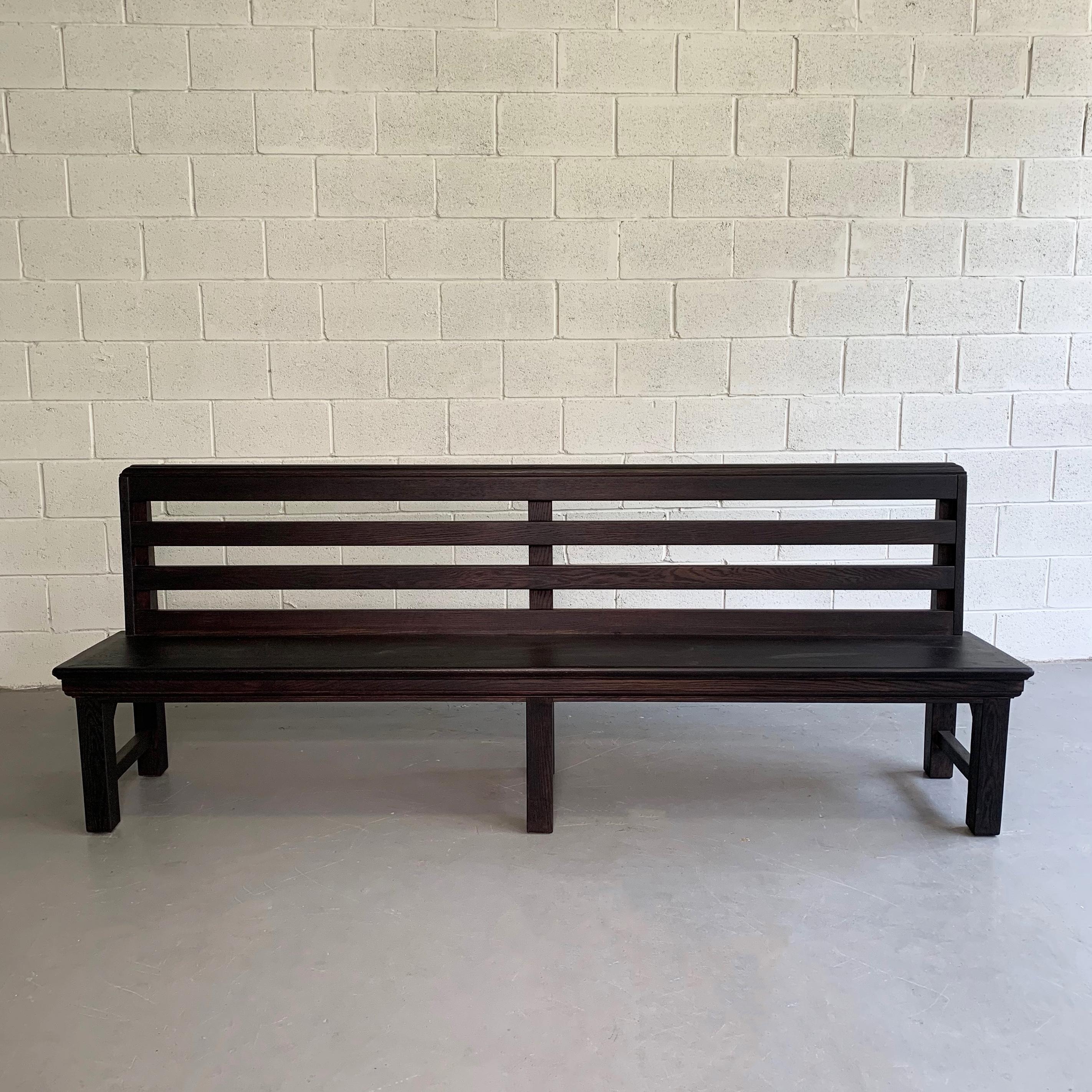Industrial, 1940s, oak, train station bench features an ebonized finish and wonderful details all around. 
