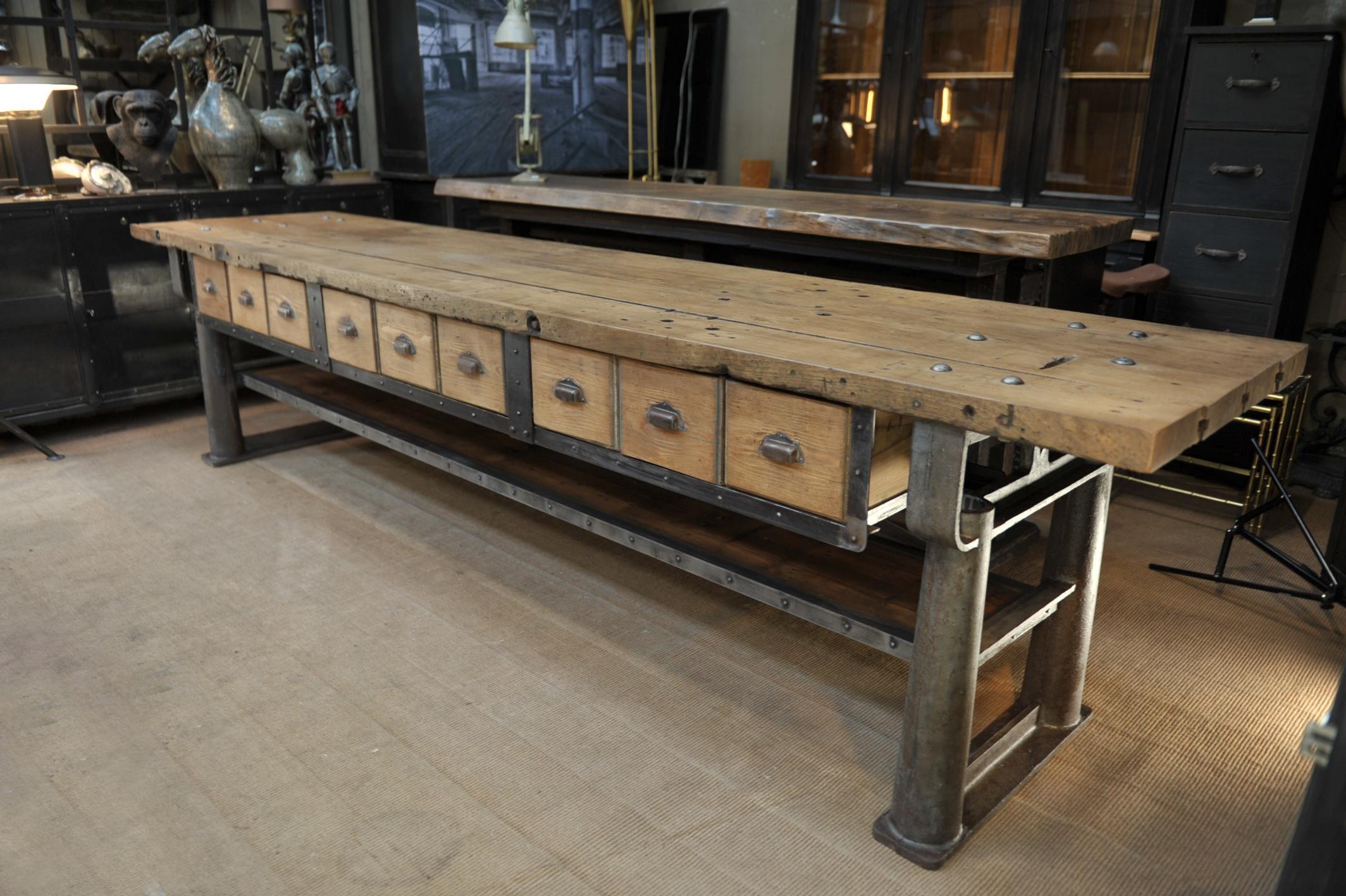 Very rare all original large console or center work table in cast iron structure, original solid oak top, one lower shelve and 9 drawers in pine wood. From French Factory, circa 1900. Sand and wax finish.
  