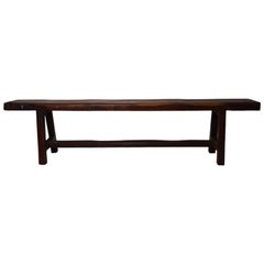 Antique Long Javanese 19th Century Wooden Bench with Brown Finish and Cross Stretcher