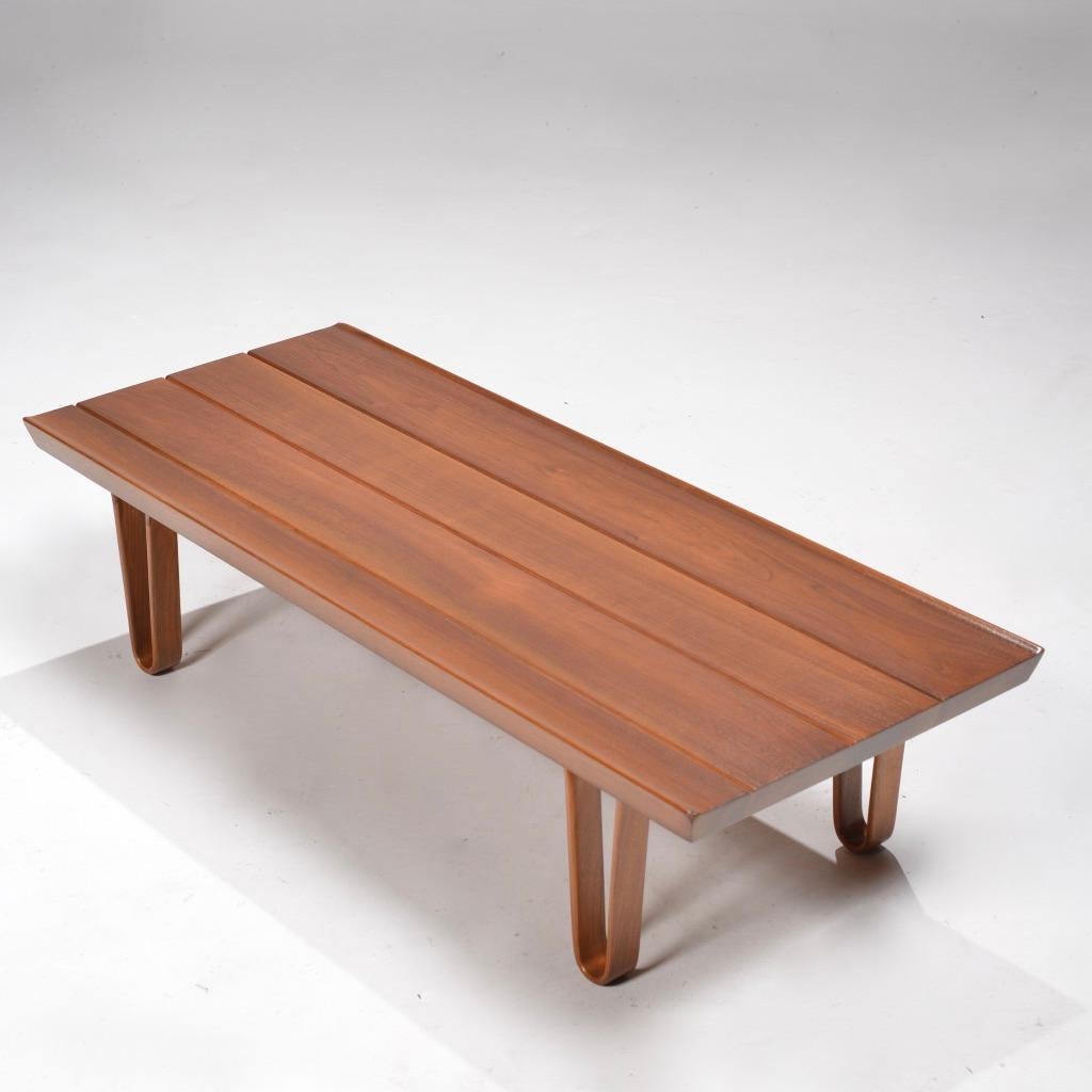 Sleek low profile coffee table designed by Edward Wormley for Dunbar, circa 1950s
Beautifully constructed of solid sap walnut, with steam bent walnut legs.
Fully marked.