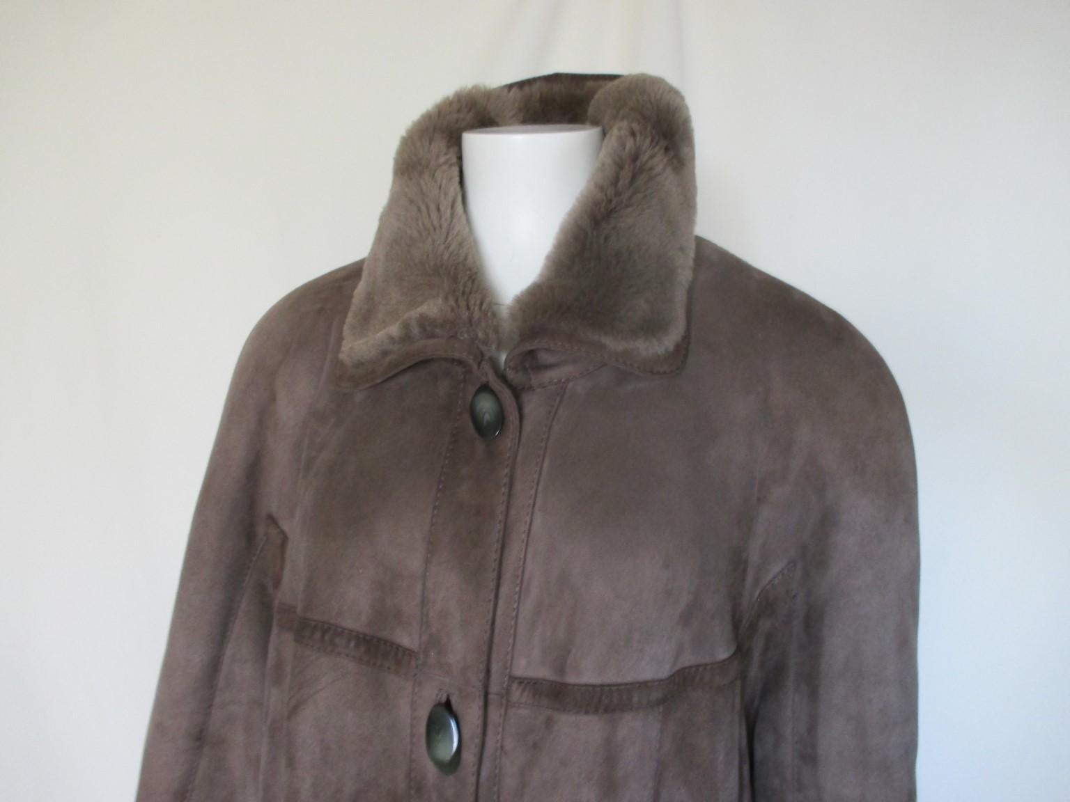 Superb quality suede exterior and lamb interior long vintage coat.

We offer more lambskin, shearling and fur items, see our frontstore

Details:
With 2 pockets and 4 buttons
Sleeves can be roll up and down
Color is Taupe/light brown
From the