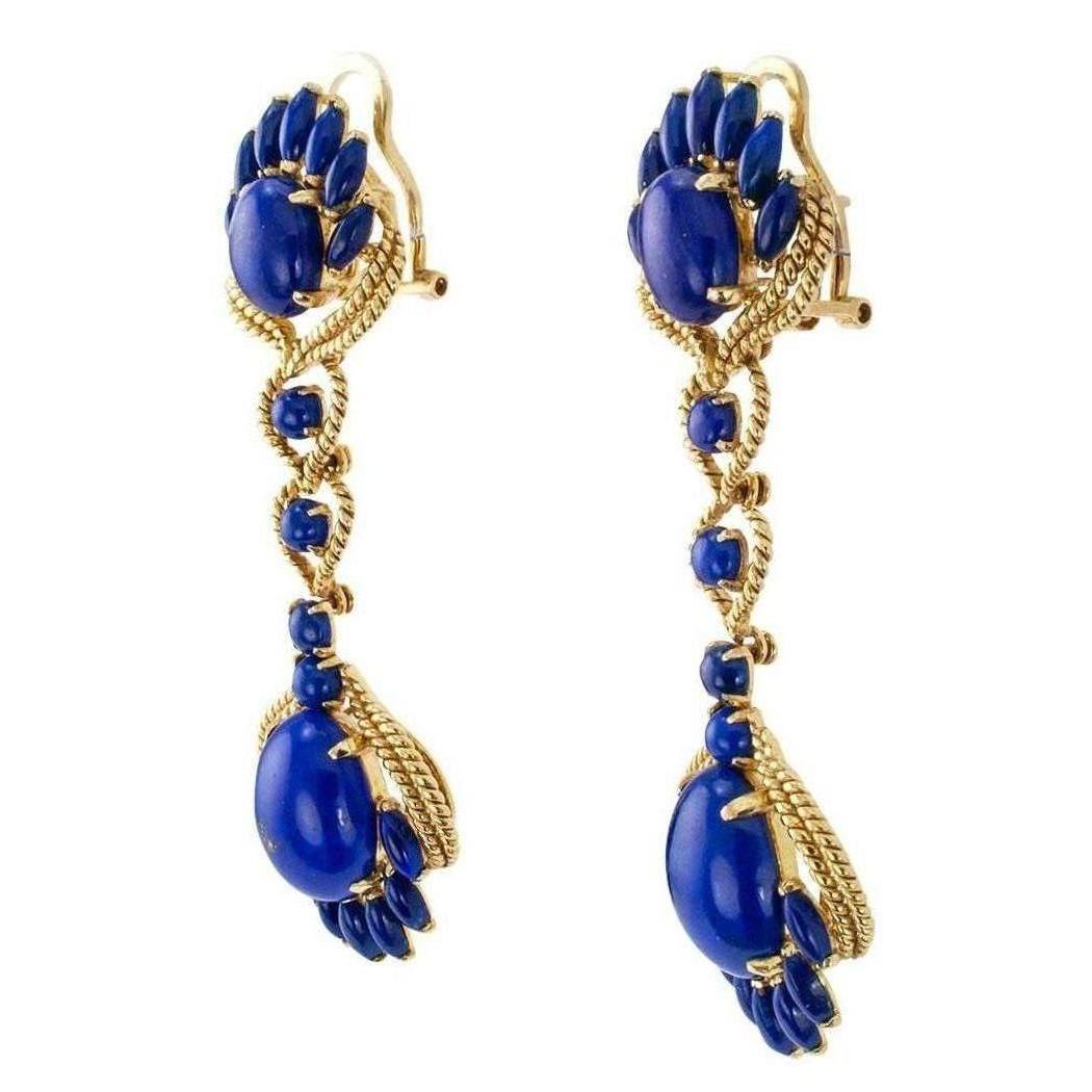 Estate 1970s lapis lazuli and gold pendent earrings. The articulated designs are long, handcrafted from corded 14-karat yellow gold and set throughout with various shapes and sizes of royal-blue lapis lazuli cabochons, the backs fitted with omega