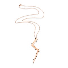 Long collier lumineux en or rose 14 carats avec diamants noirs