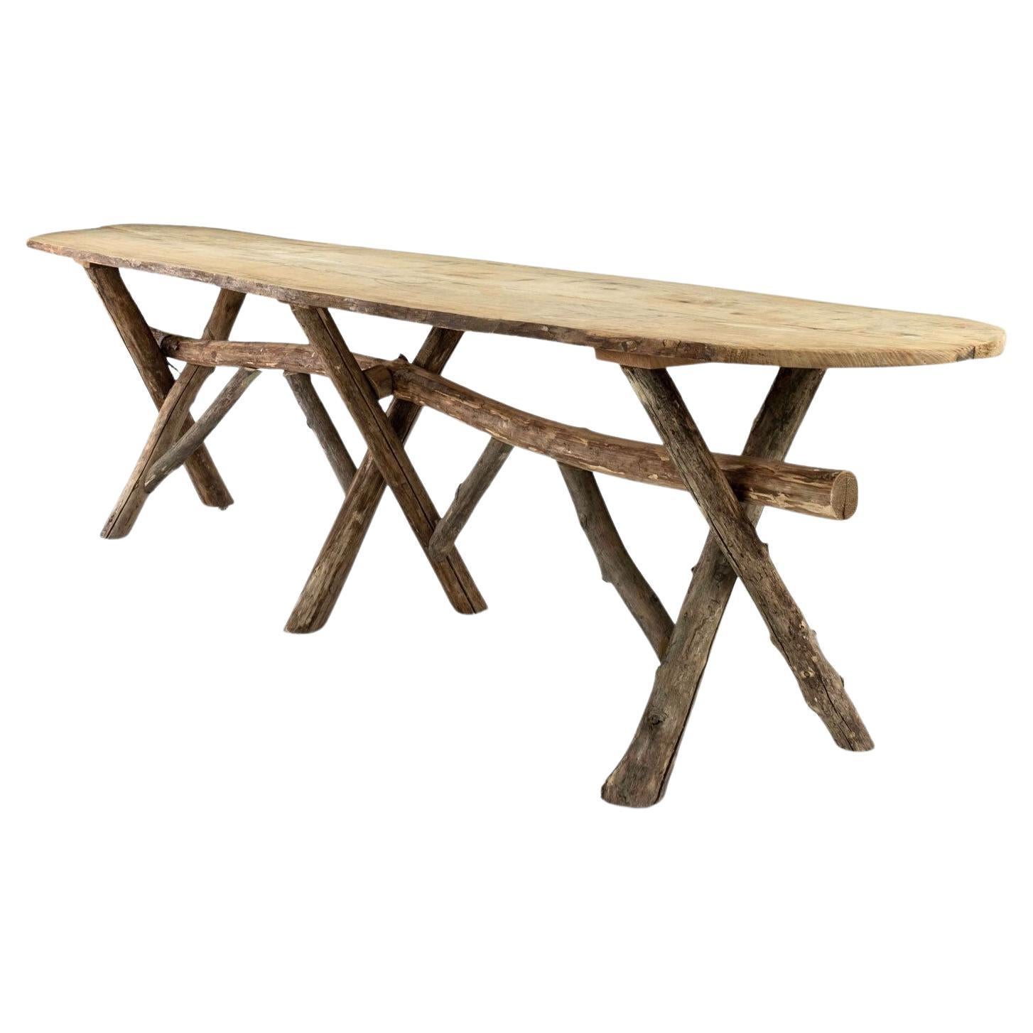 Long Live-Edge Oval Top Table with Natural Shaped Trestle Base