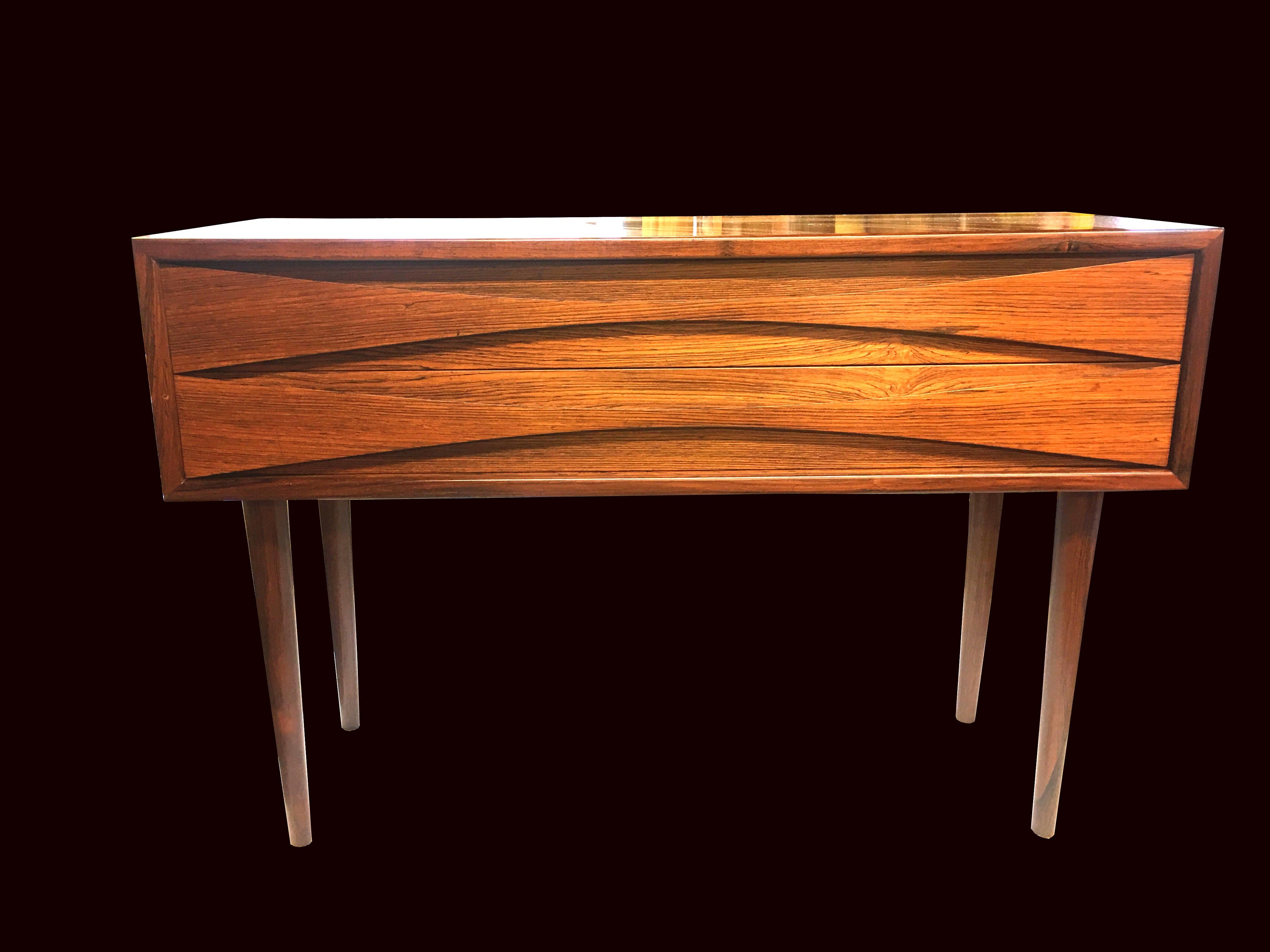 Another great design from Arne Vodder, a long low cabinet with the distinct 'Vodder' bow tie shaped drawers in very nice condition.