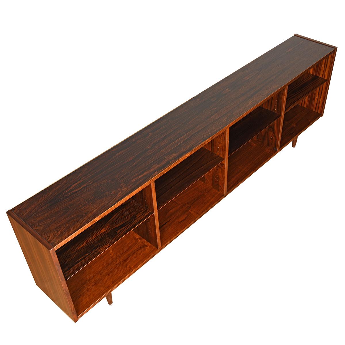 Perfect for placing under a window, we present this beautiful low and long bookcase. 4 vertical sections of equal Size with one adjustable shelf.
Edge of each shelf is beveled.

*Due to time, labor costs, and heightened restrictions on Brazilian