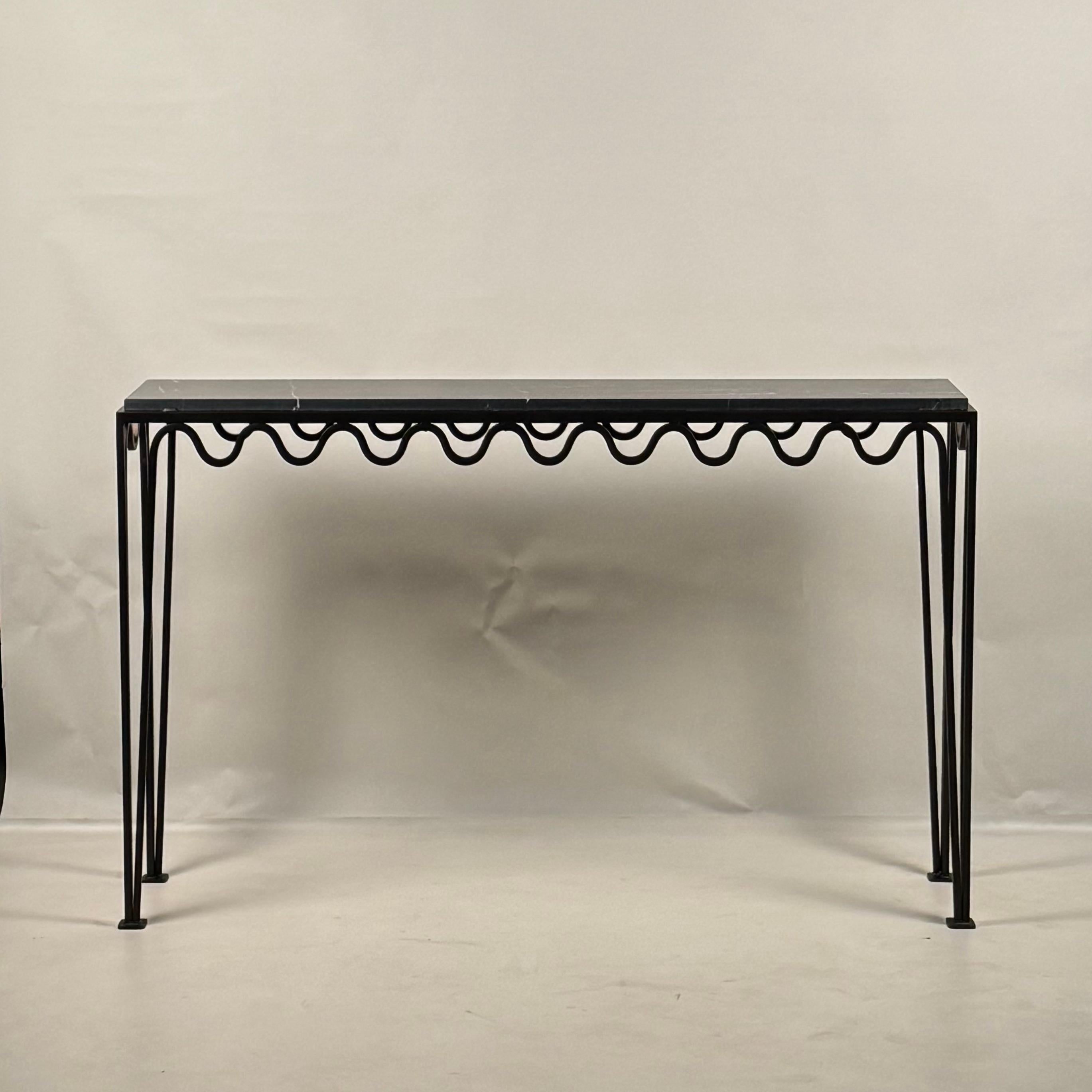 Long Méandre™ dark bronze finish and honed Nero Marquina marble top console by Design Frères®.
Chic and understated.
