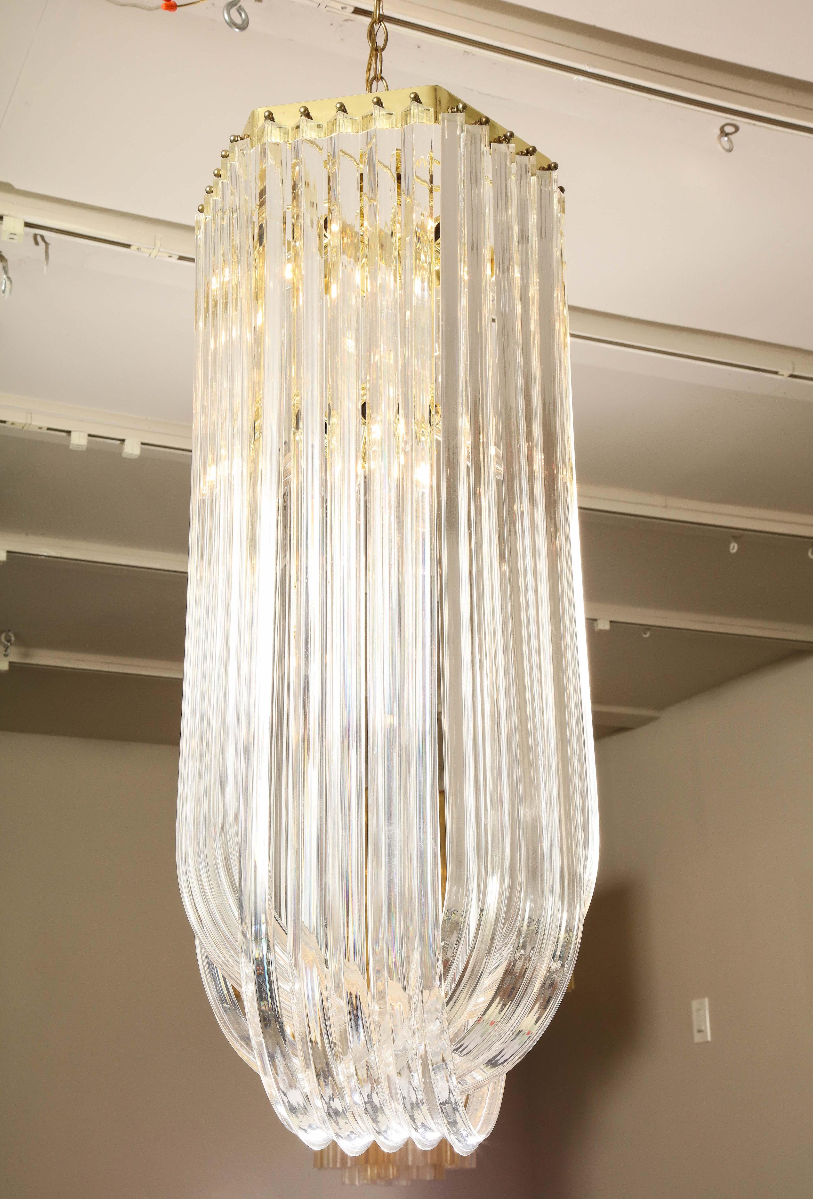 Late 20th Century Long Mid-Century Curved Lucite Ribbon Chandelier in Brass For Sale