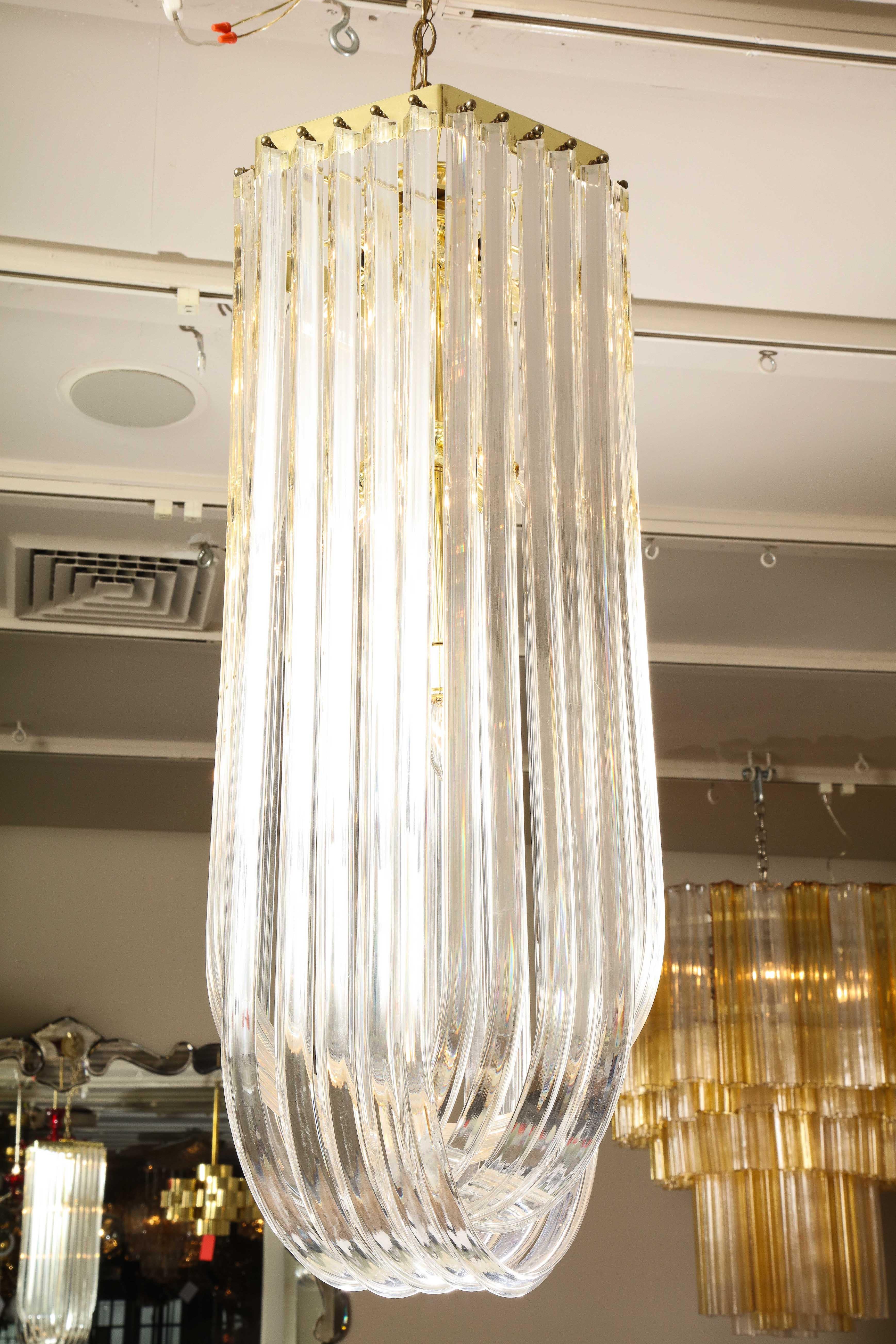 Metal Long Mid-Century Curved Lucite Ribbon Chandelier in Brass For Sale