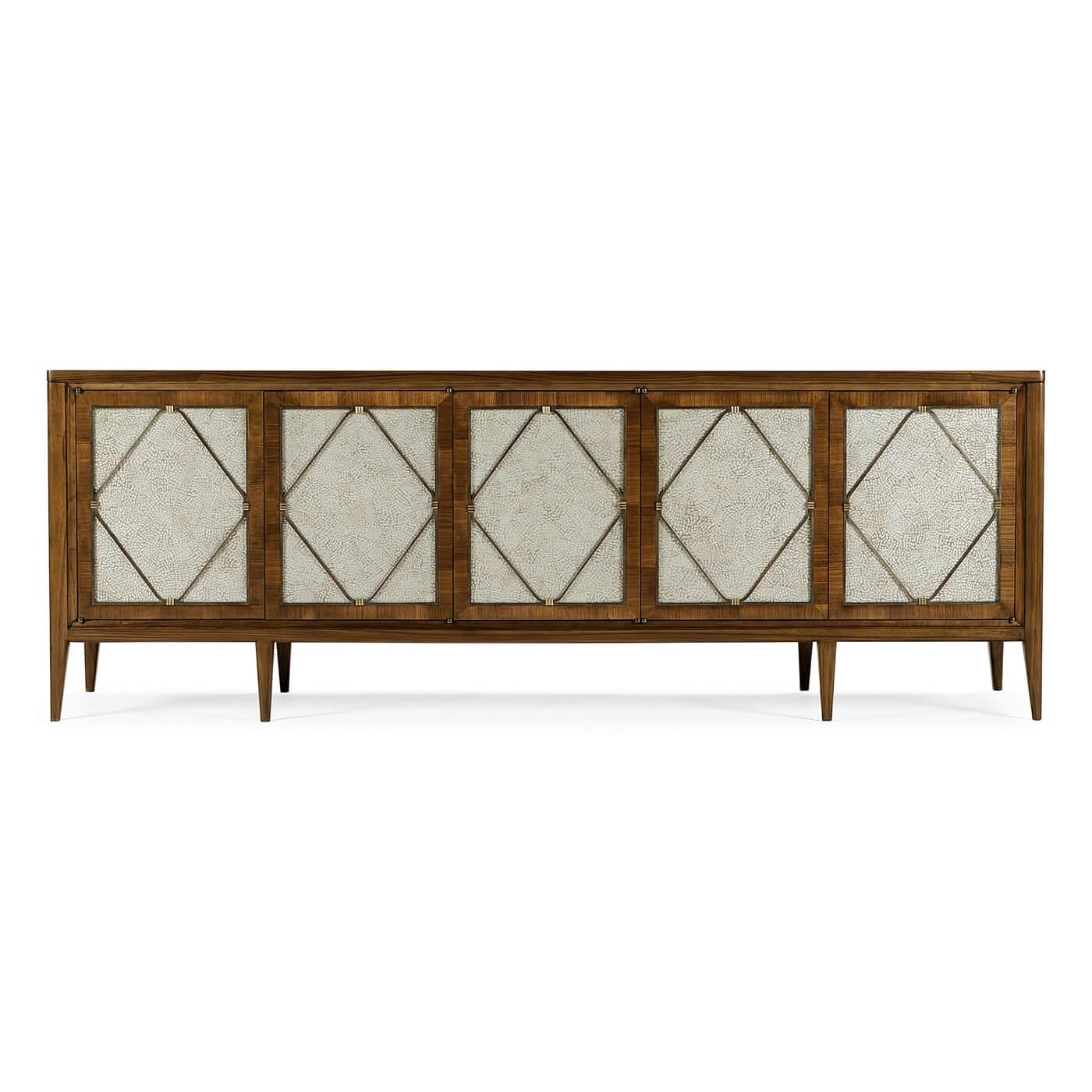A Long Mid-Century Modern style media cabinet. This cabinet is constructed of American walnut with a transparent, lacquer finish. The five doors feature duck eggshell inlay panels and the interior fitted with long shelves. The hardware is cast from